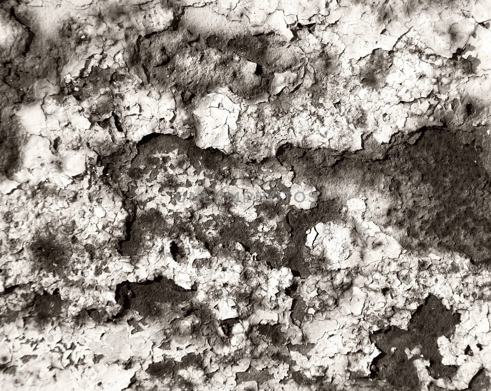 Painted wall with cracks monochrome background
