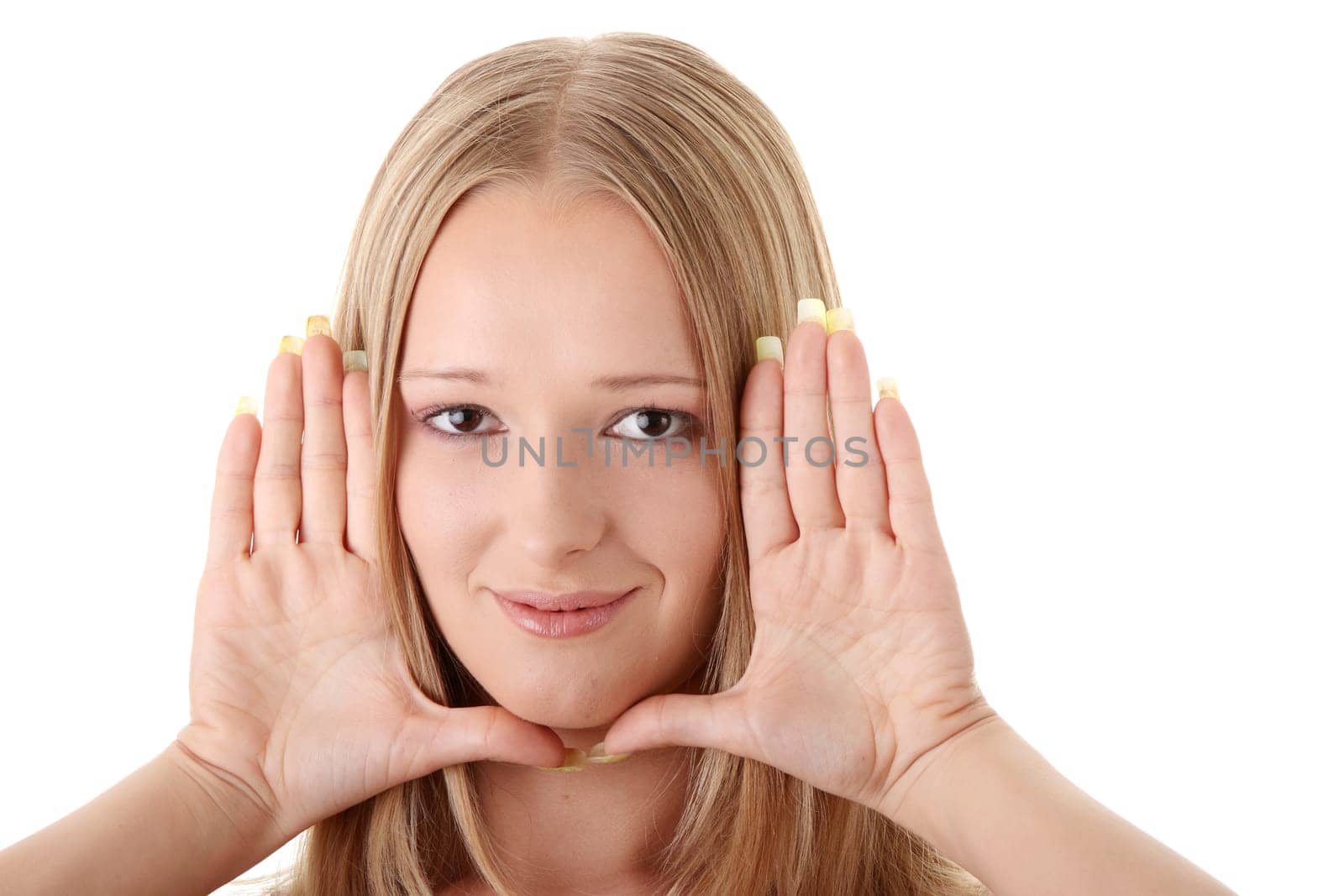 Young blond woman frame her face with hands
