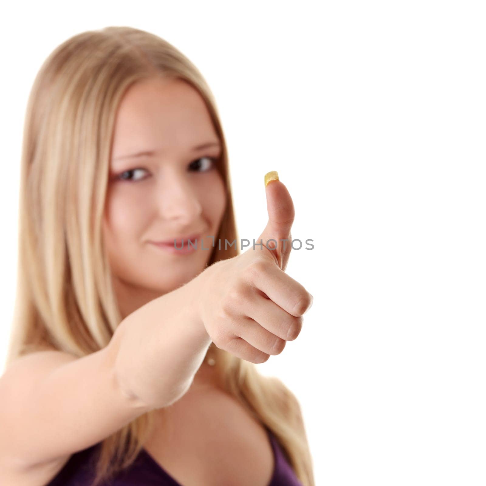 Casual woman smiling with her thumbs up - isolated