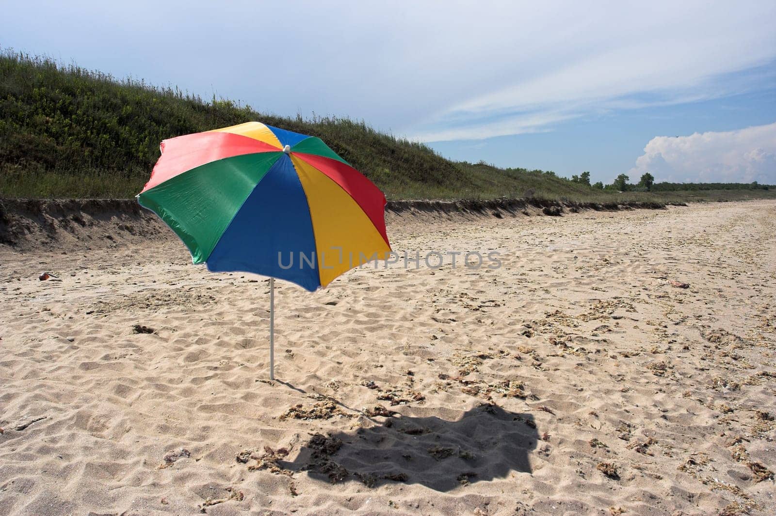 Beach umbrella against summer sky