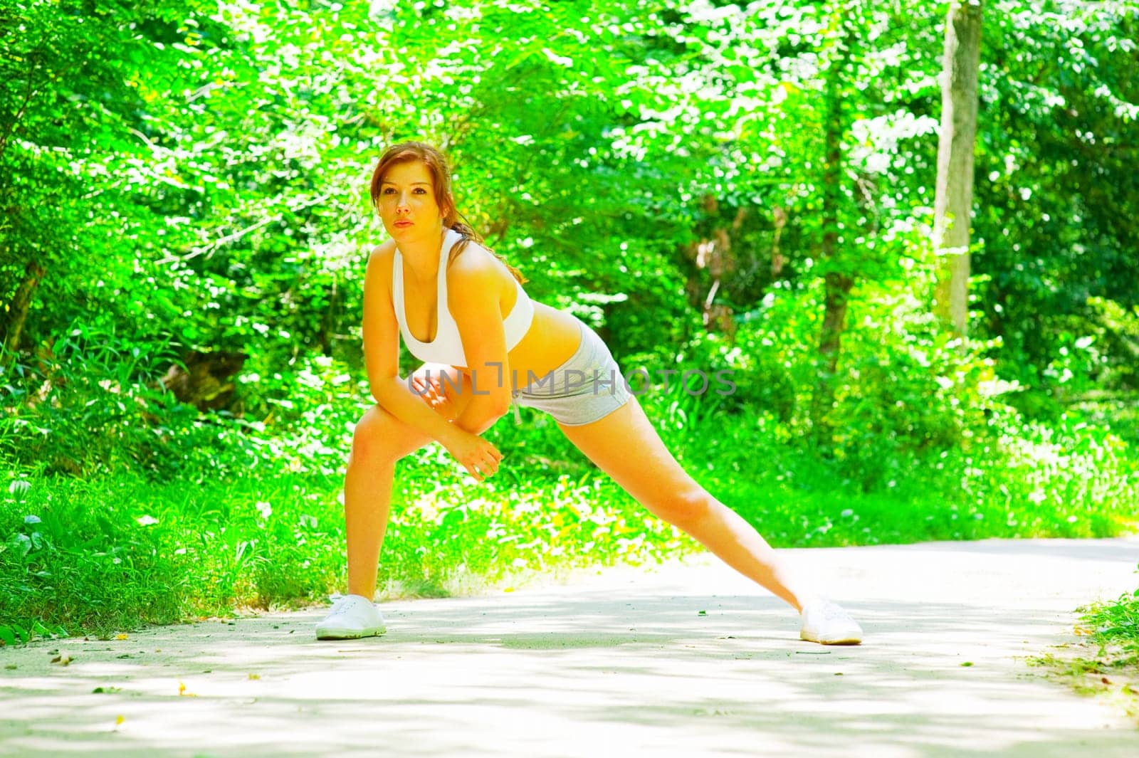 Woman runner exercising, from a complete series of photos.