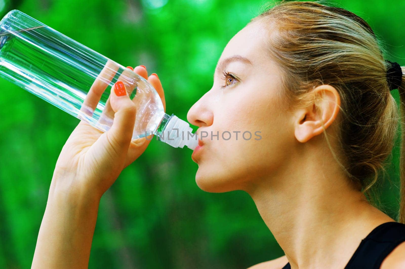 Blonde haired woman exercising, from a complete series of photos.