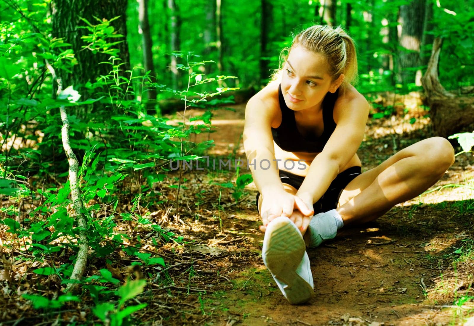 Blonde haired woman exercising, from a complete series of photos.