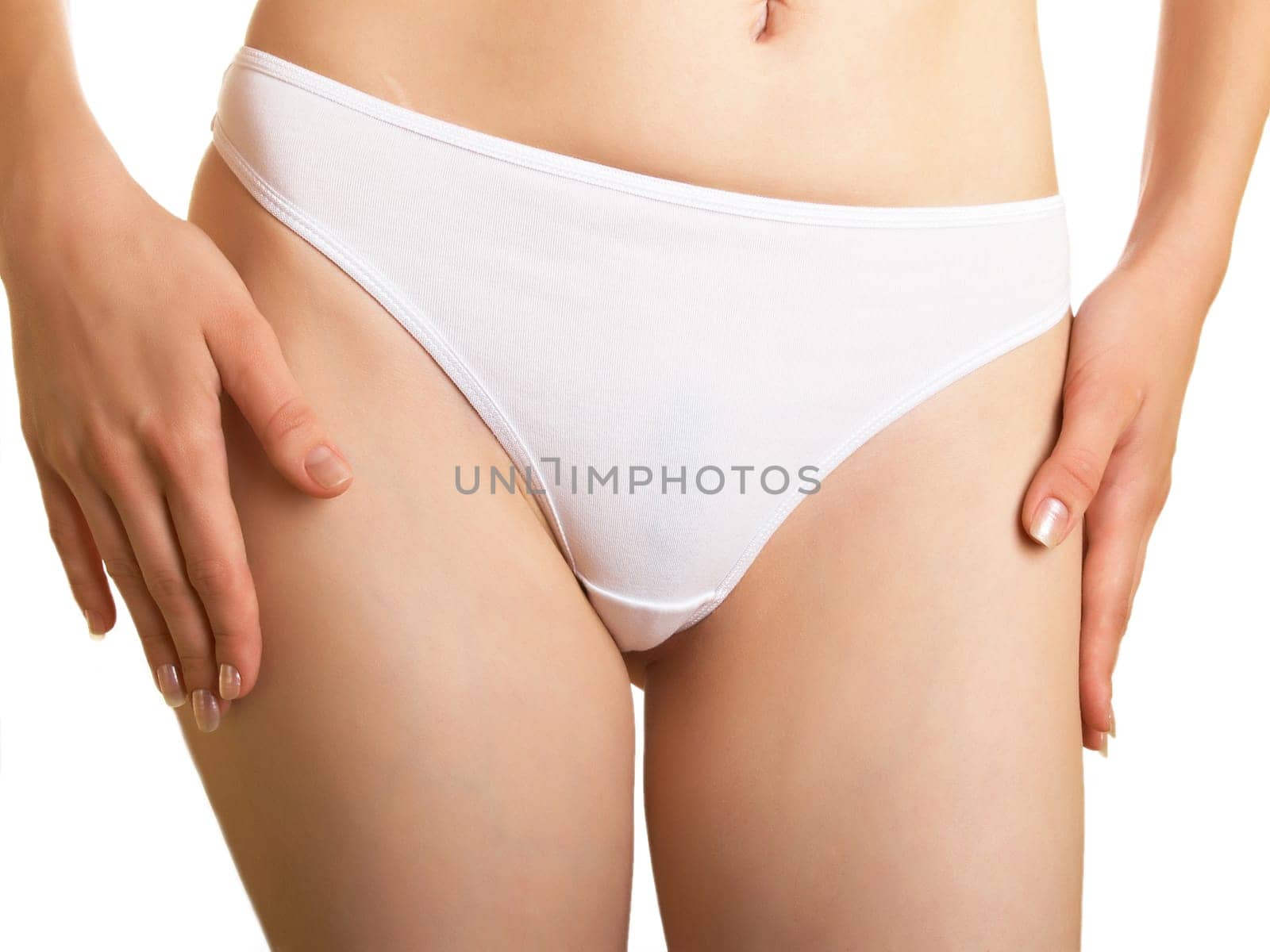 Part of a female body in cowards on a white background