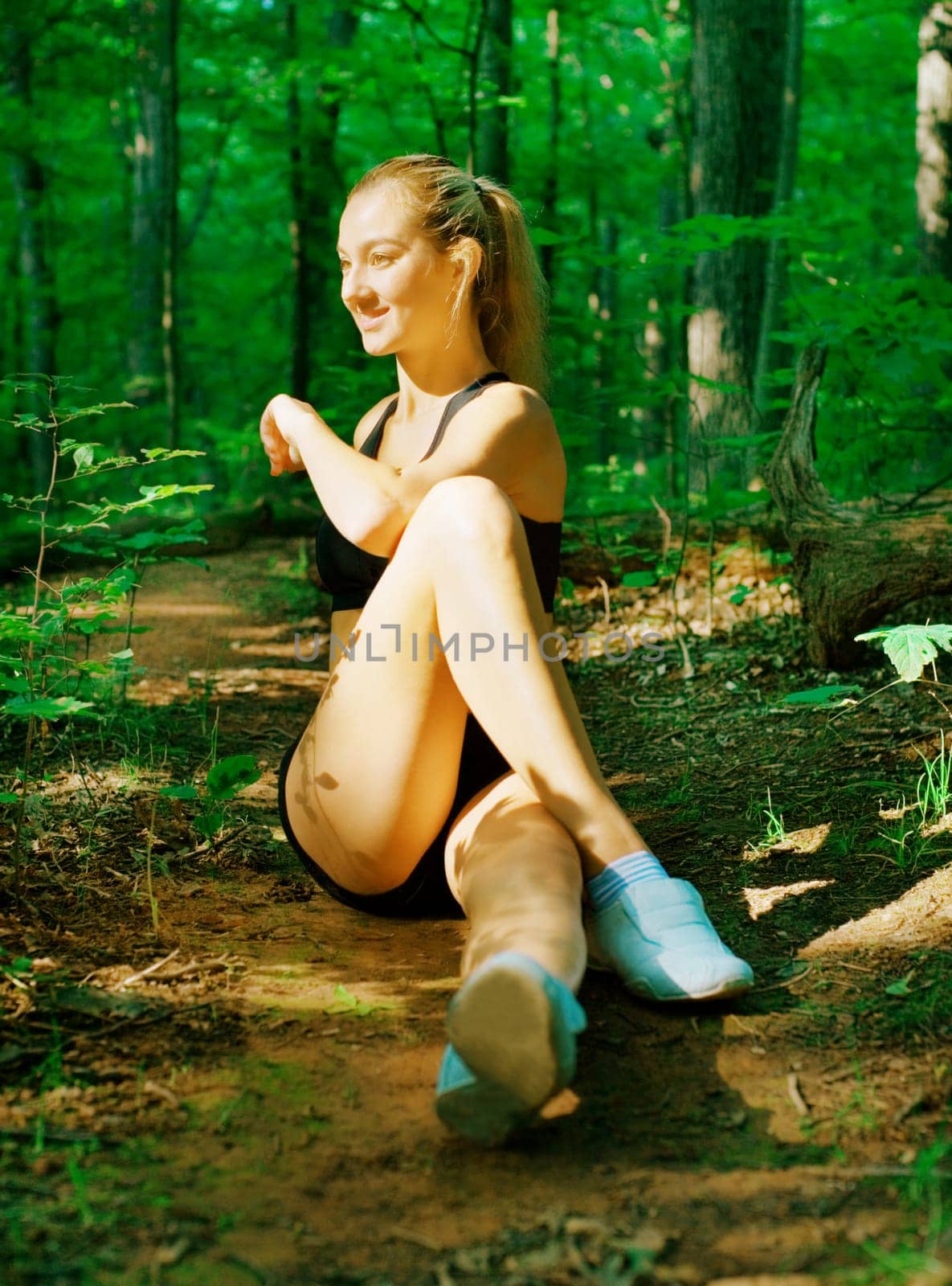 Blonde haired woman exercising, from a complete series of photos.