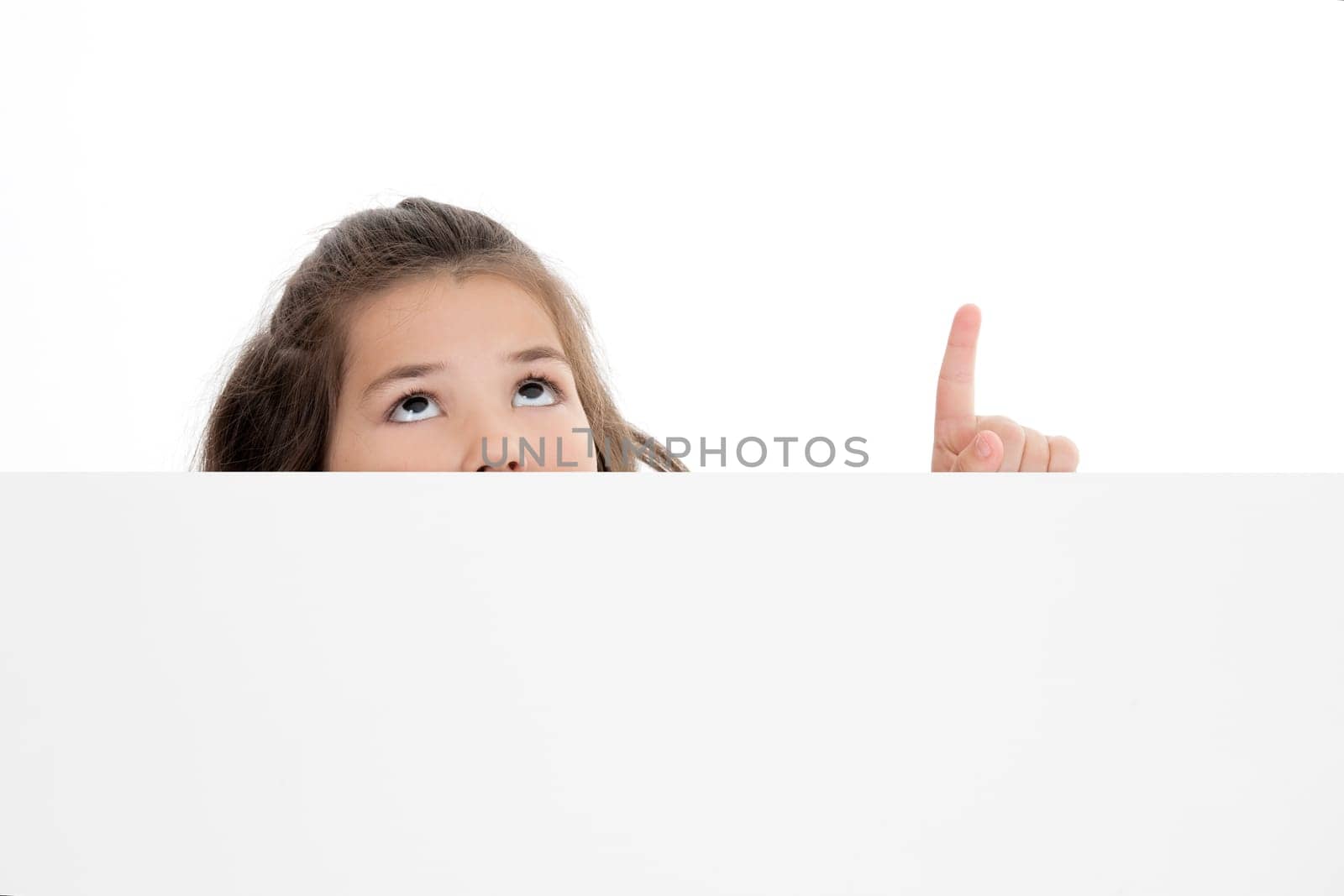 Cute Caucasian girl holding a blank sign