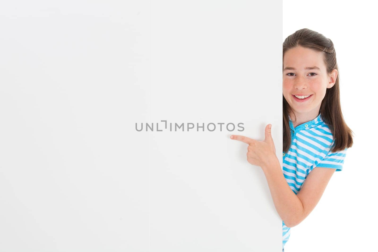 Cute Caucasian girl holding a blank sign