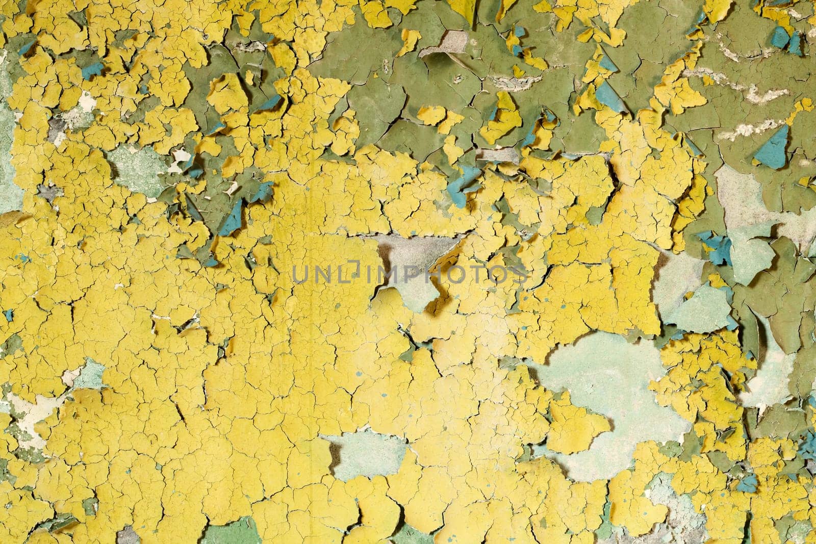 Old damaged paint on a concrete wall background