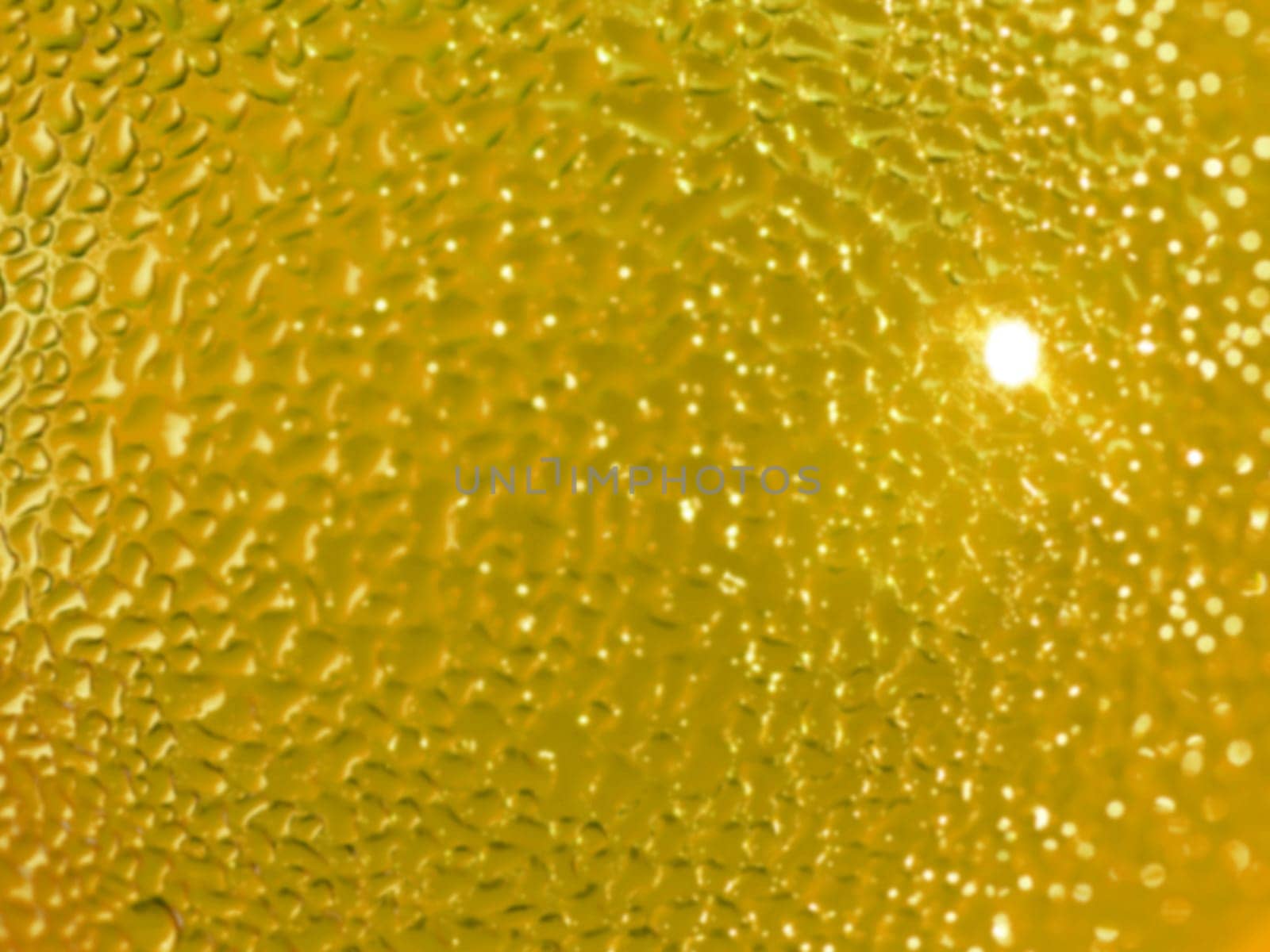 Water droplets formed from condensation inside a bottle gold tone