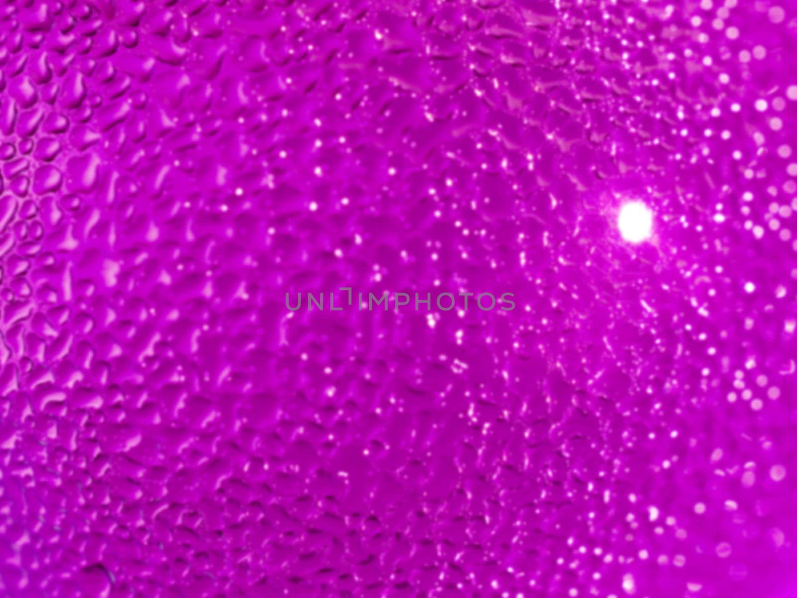 Water droplets formed from condensation inside a pink bottle