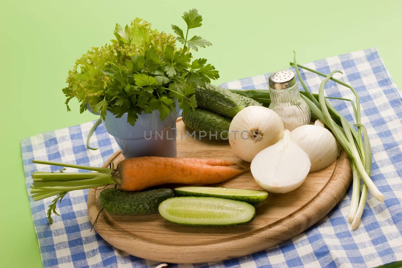 fresh vegetables: onion, carrot, cucumber and parsley