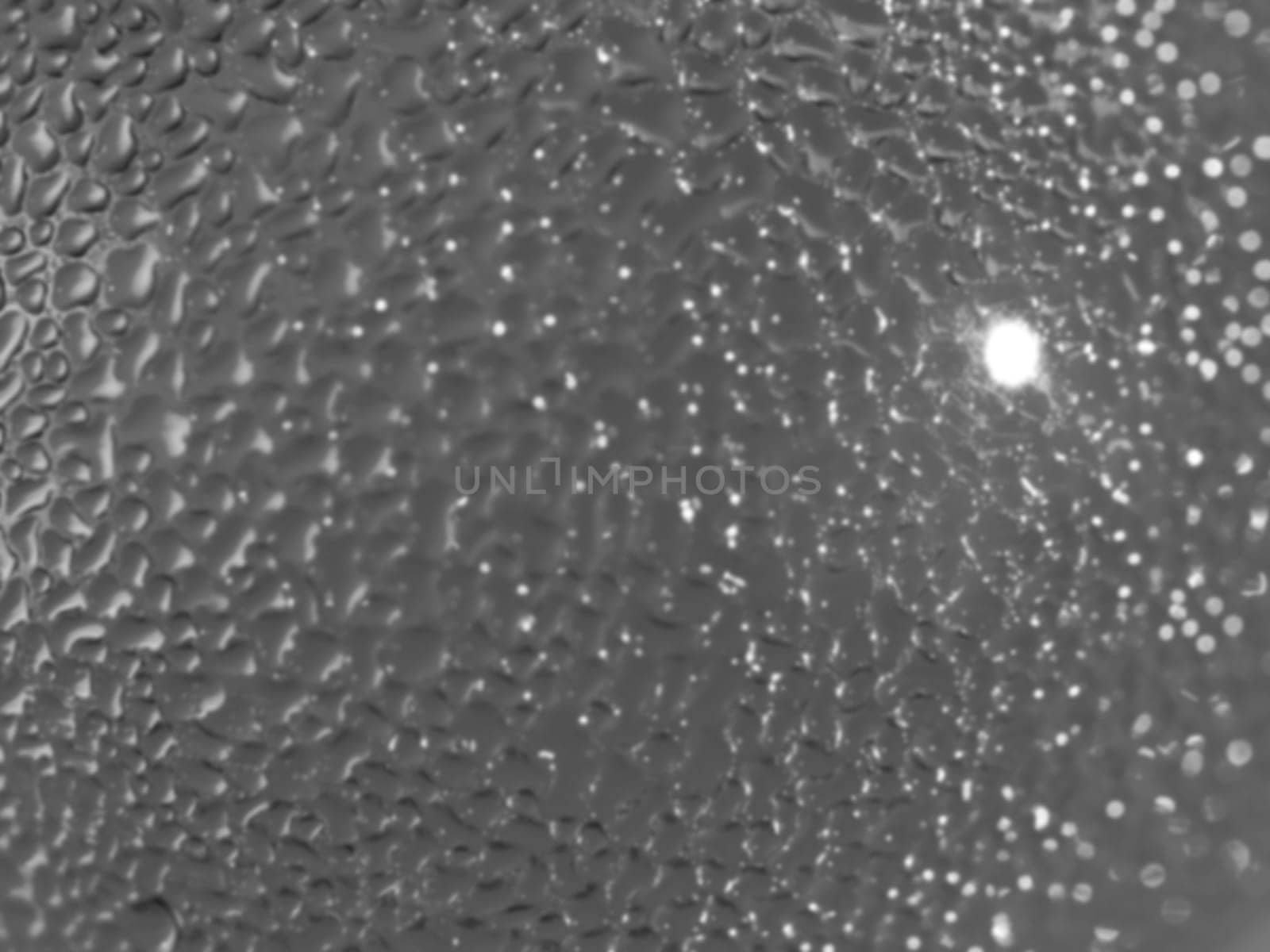 Water droplets formed from condensation inside a bottle silver tone