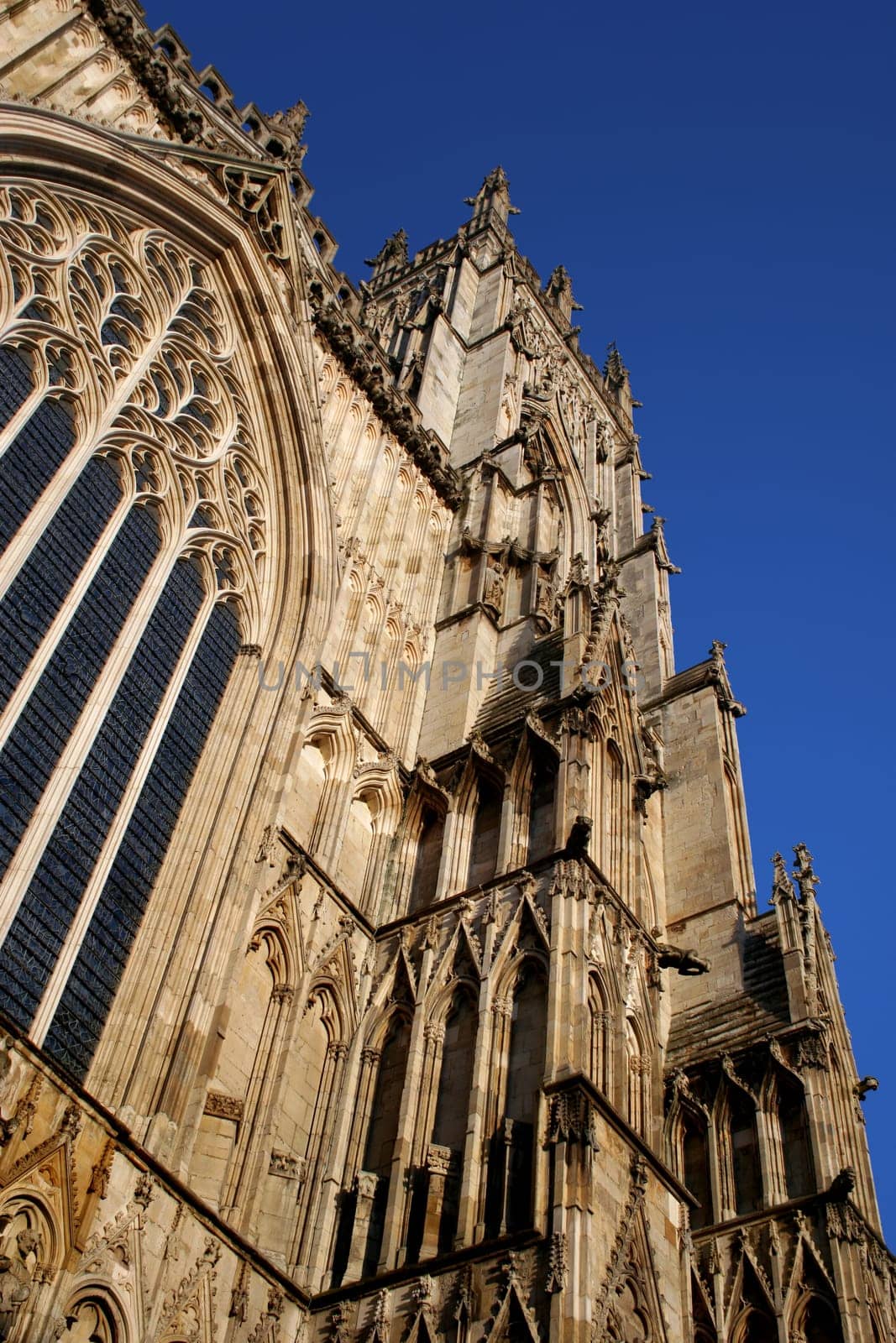One of the oldest gothic cathedrals in Europe, York Minster Cathedral stands proud against a bright blue summer sky.