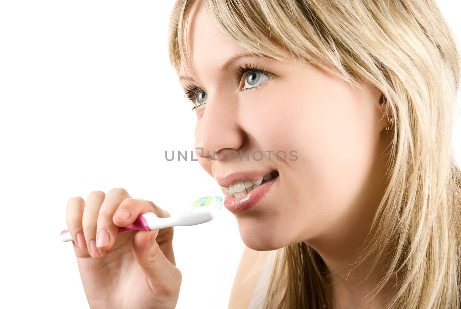 Young beautiful woman brush her teeth