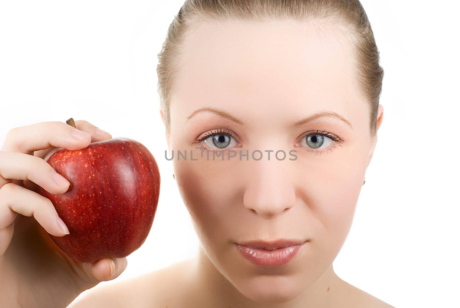 Portrait of young woman with apple, isolated on white