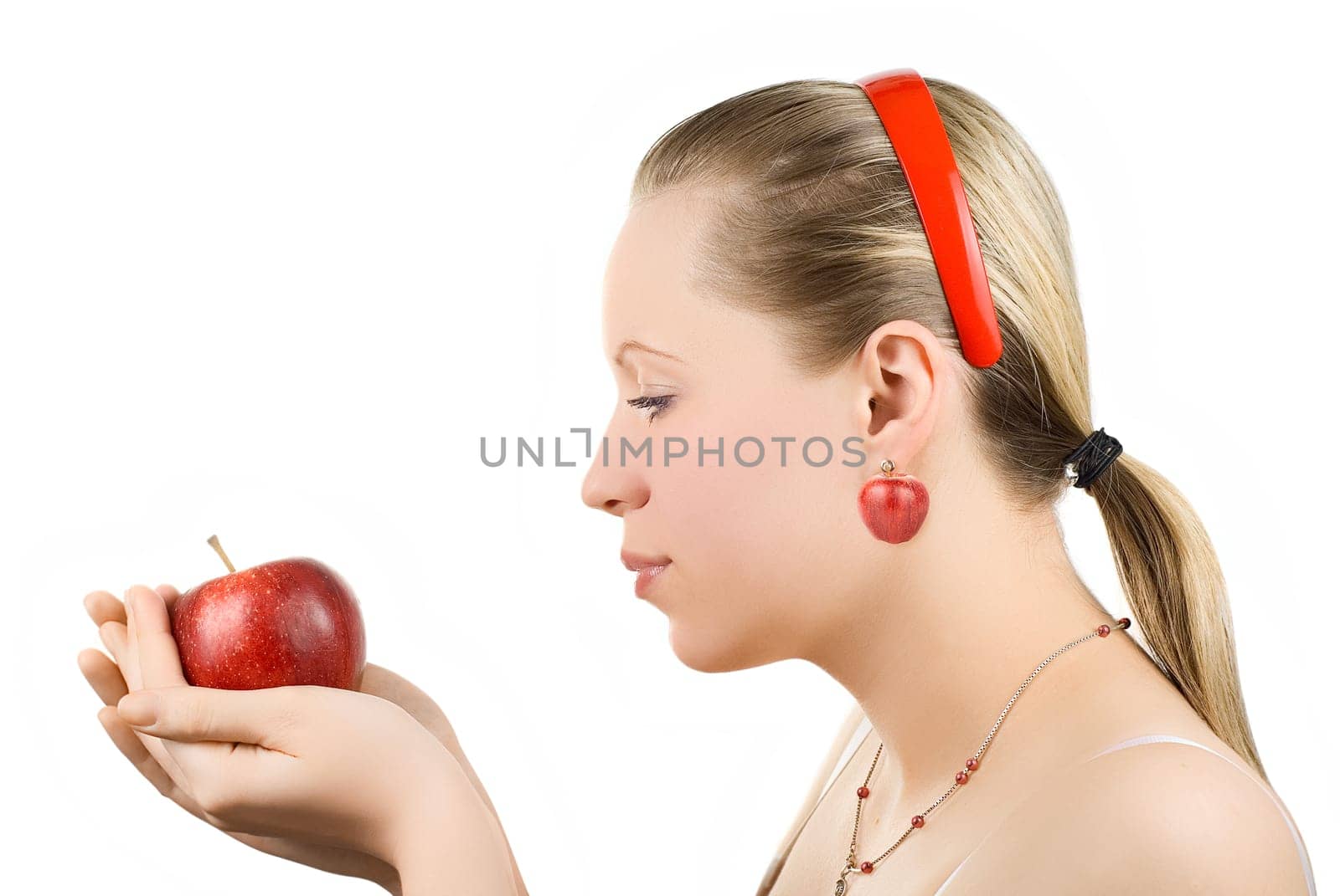 Lovely woman with apple isolated on white