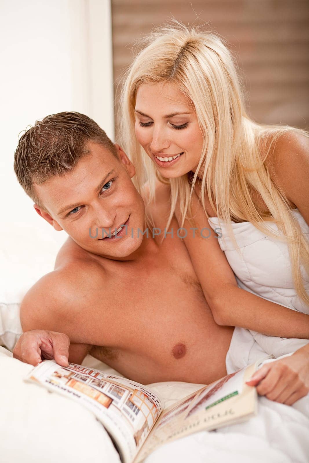 Couple reading magazine