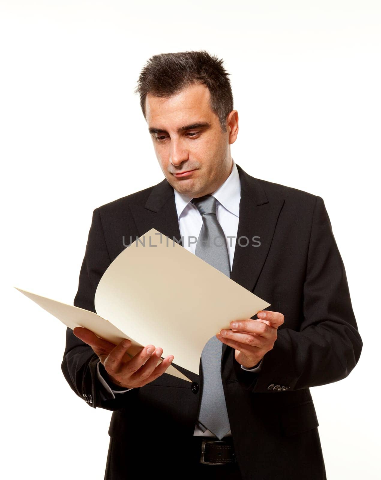 Businessman reads a document with query