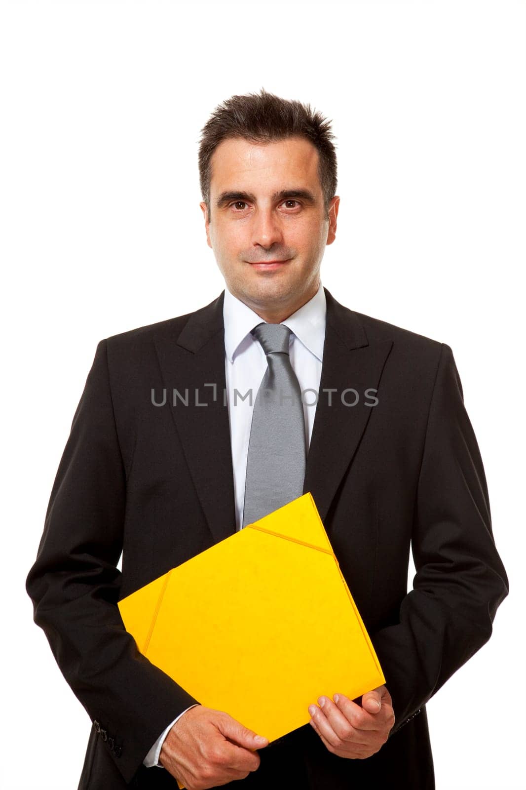 Businessman holds a yellow file from his office