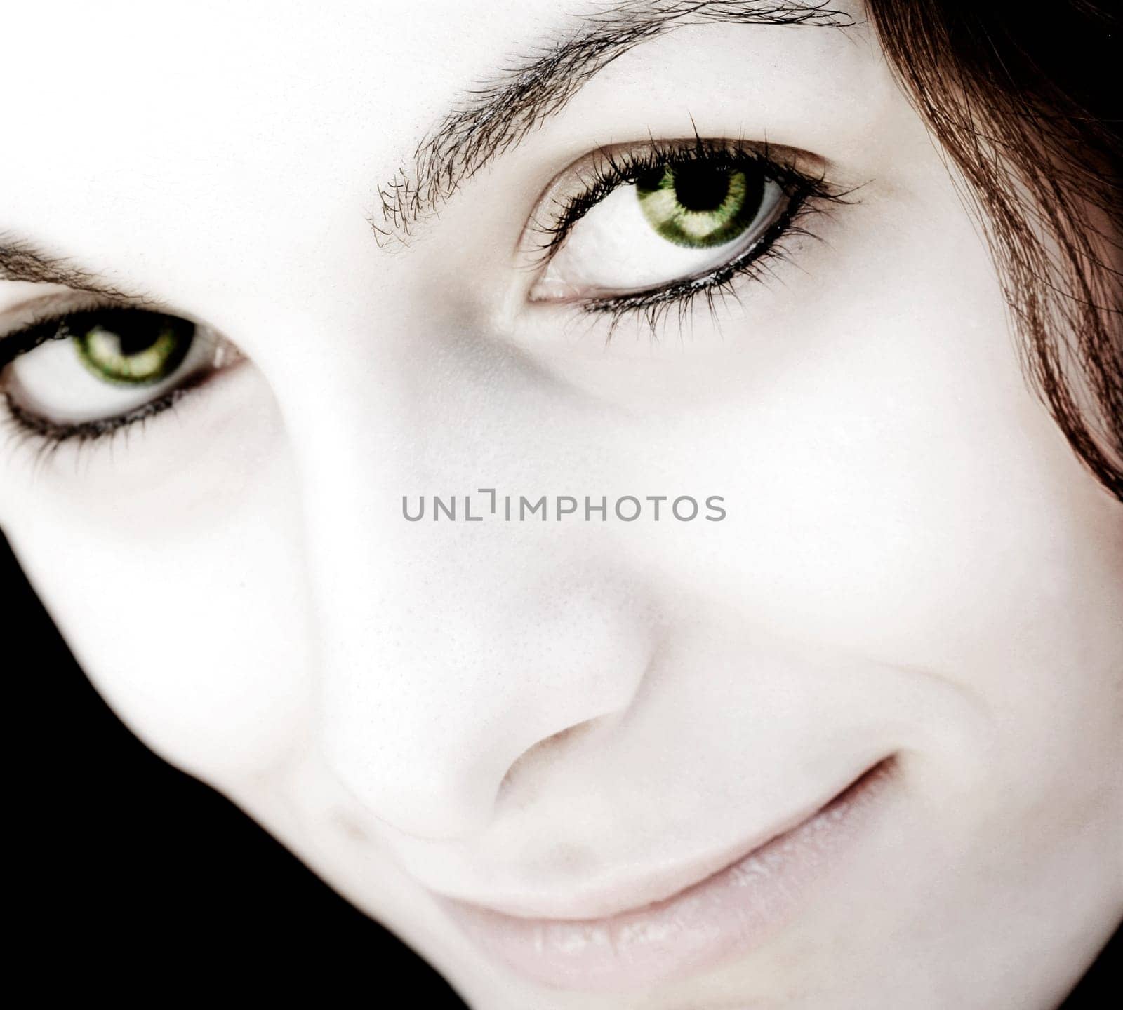 Beautiful happy woman with green eyes.