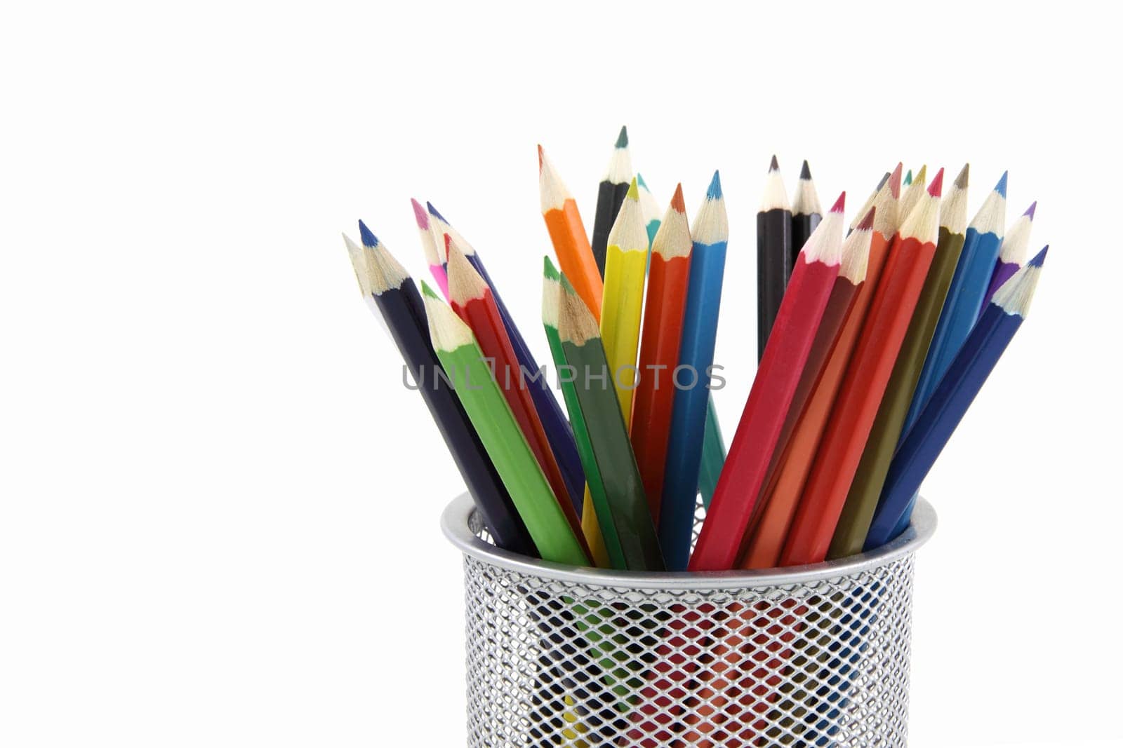 Colored pencils in metal office pencil holder isolated on white background