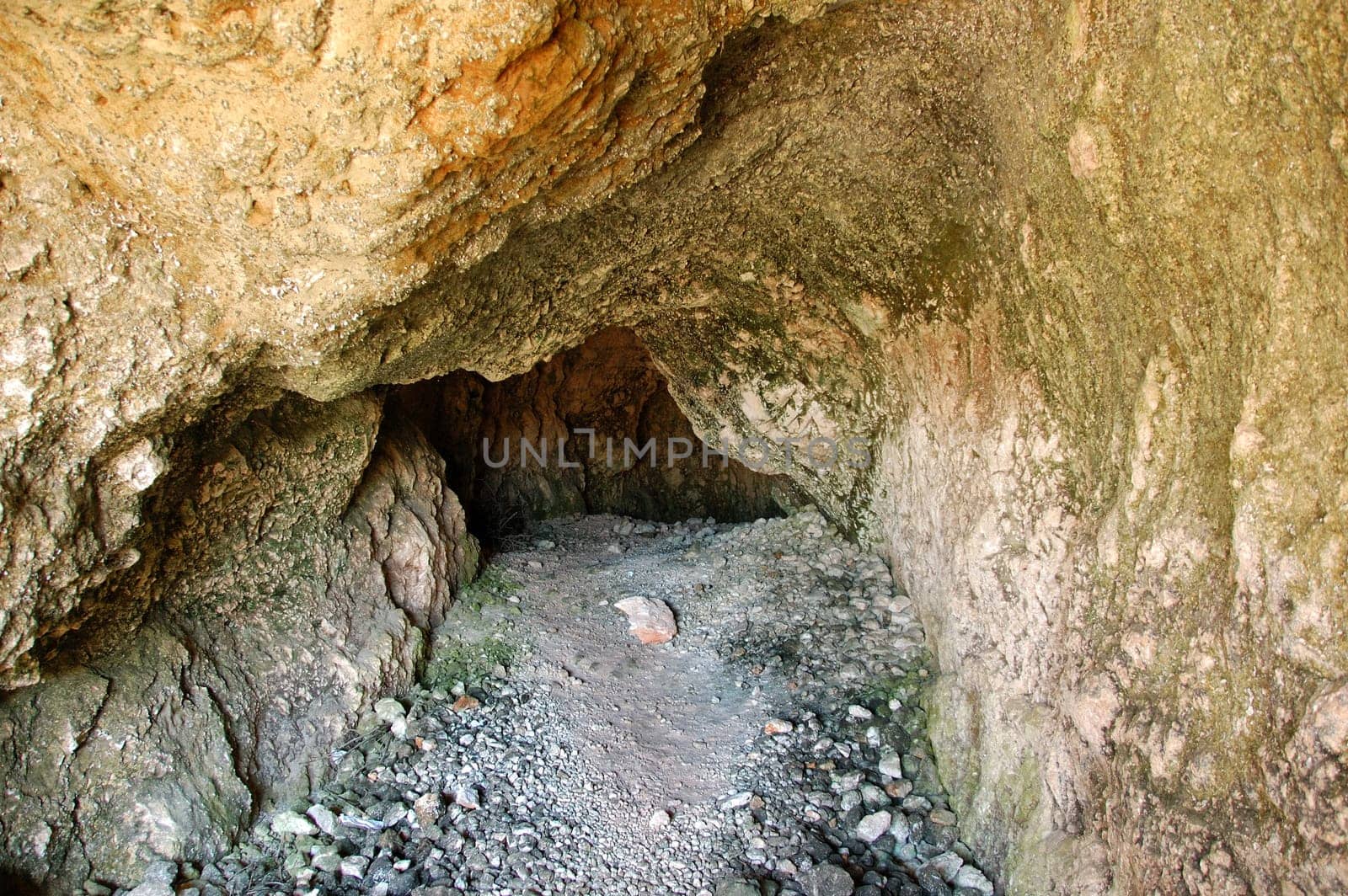 Narrow natural cave interior.