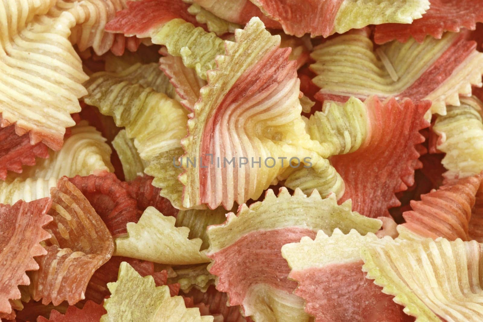 Red and yellow noodles close up as background