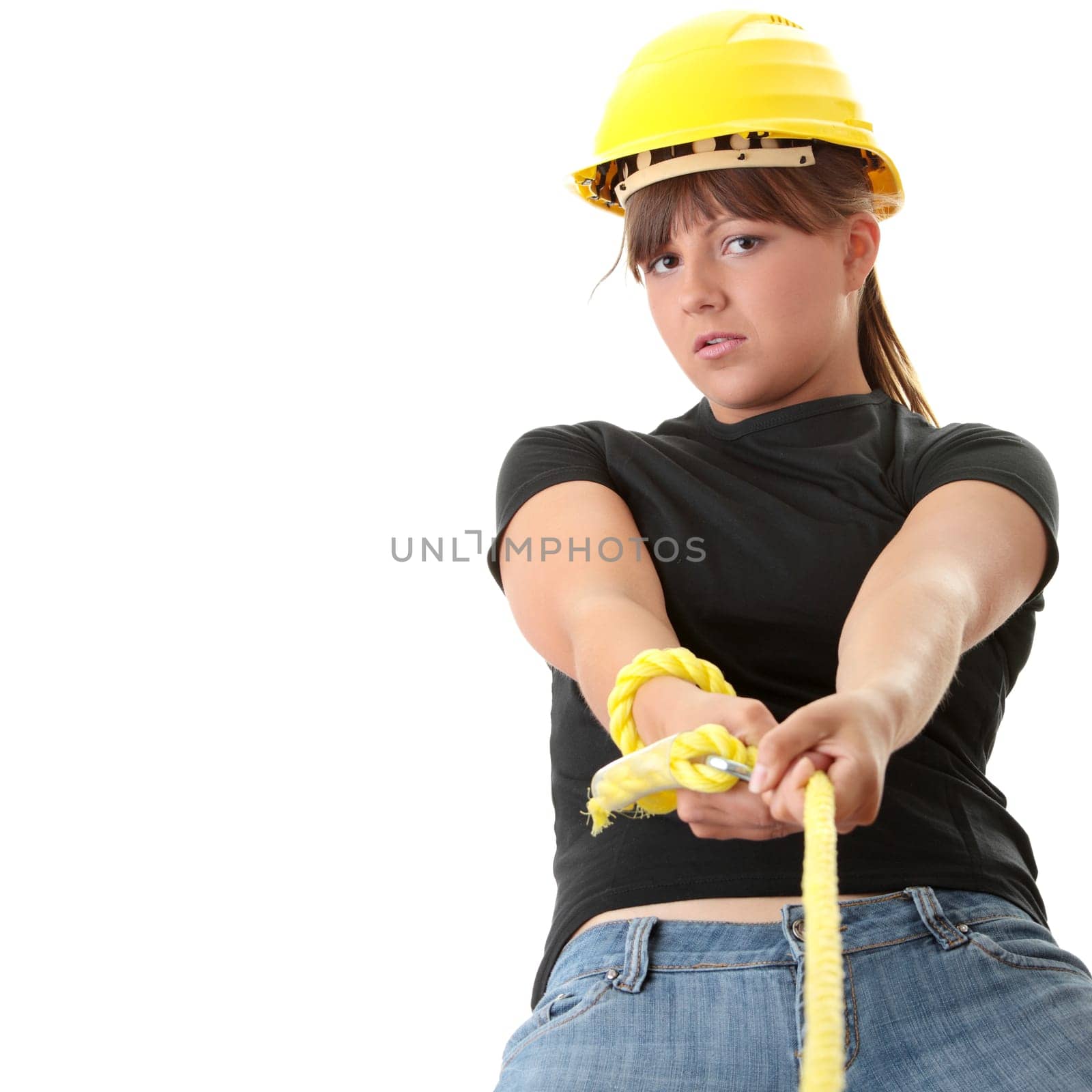 Young woman builder holding yellow rope