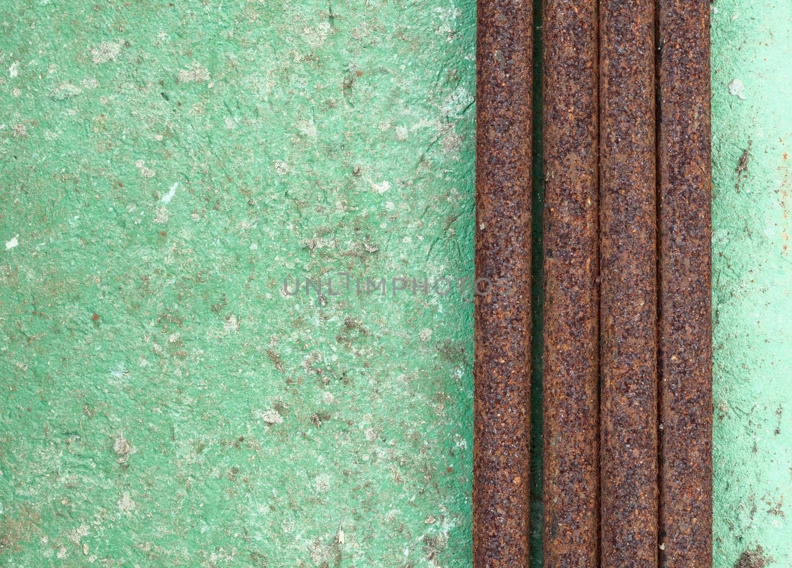 Old decayed wall with rusty pipes background