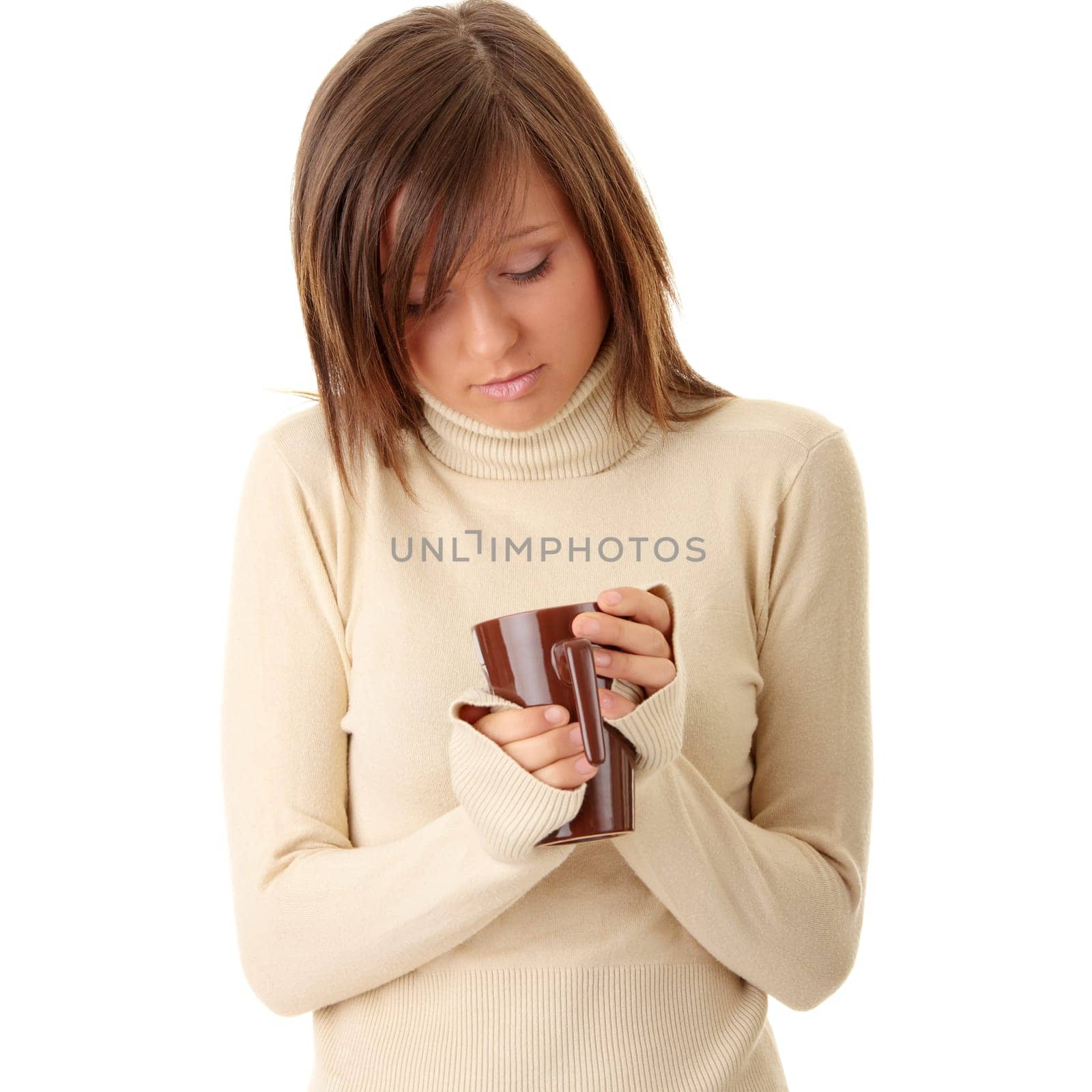 A beautiful girl (young woman) wearing polo neck sweater  holding a cup of hot drink