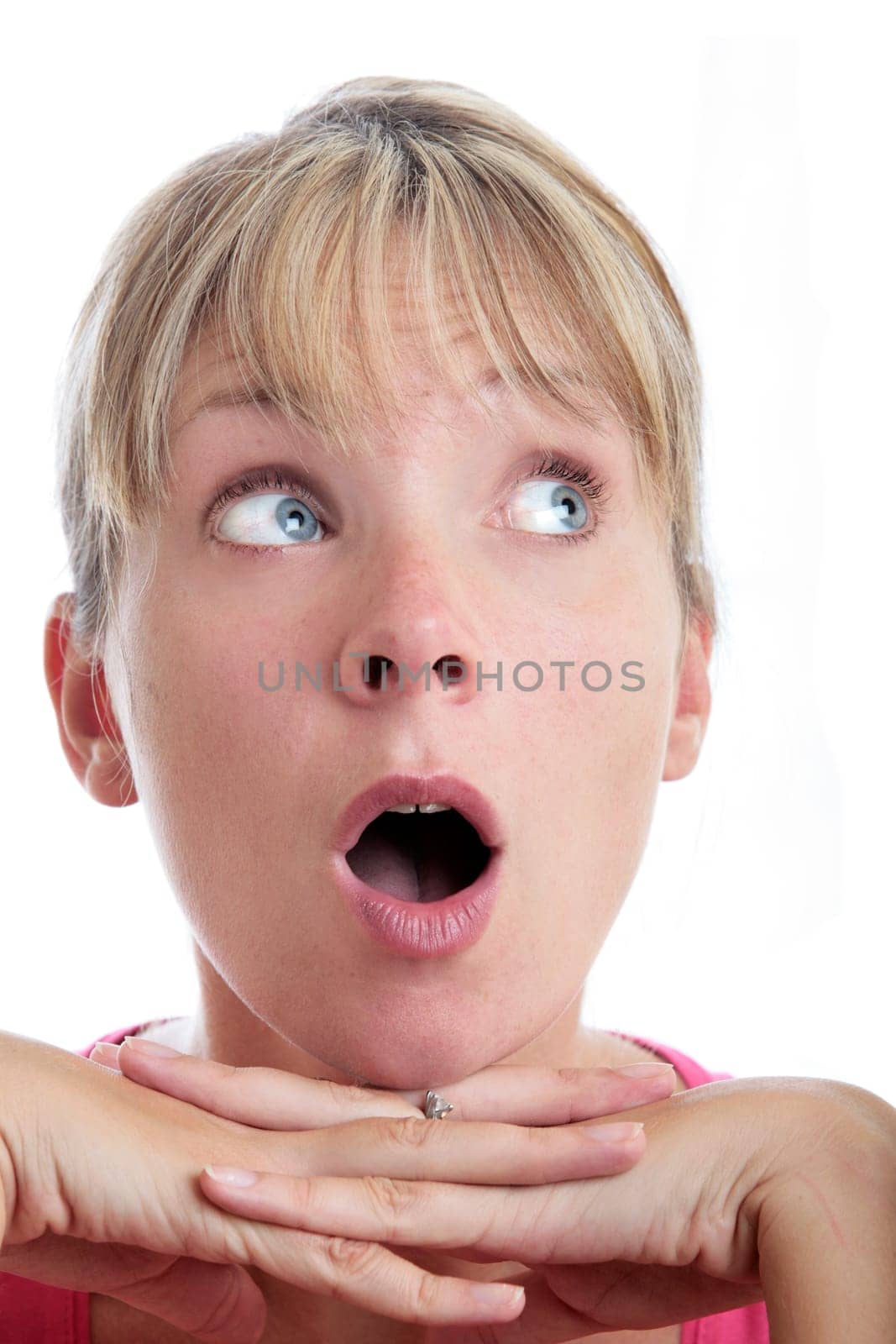 Surprised woman looking up with white background