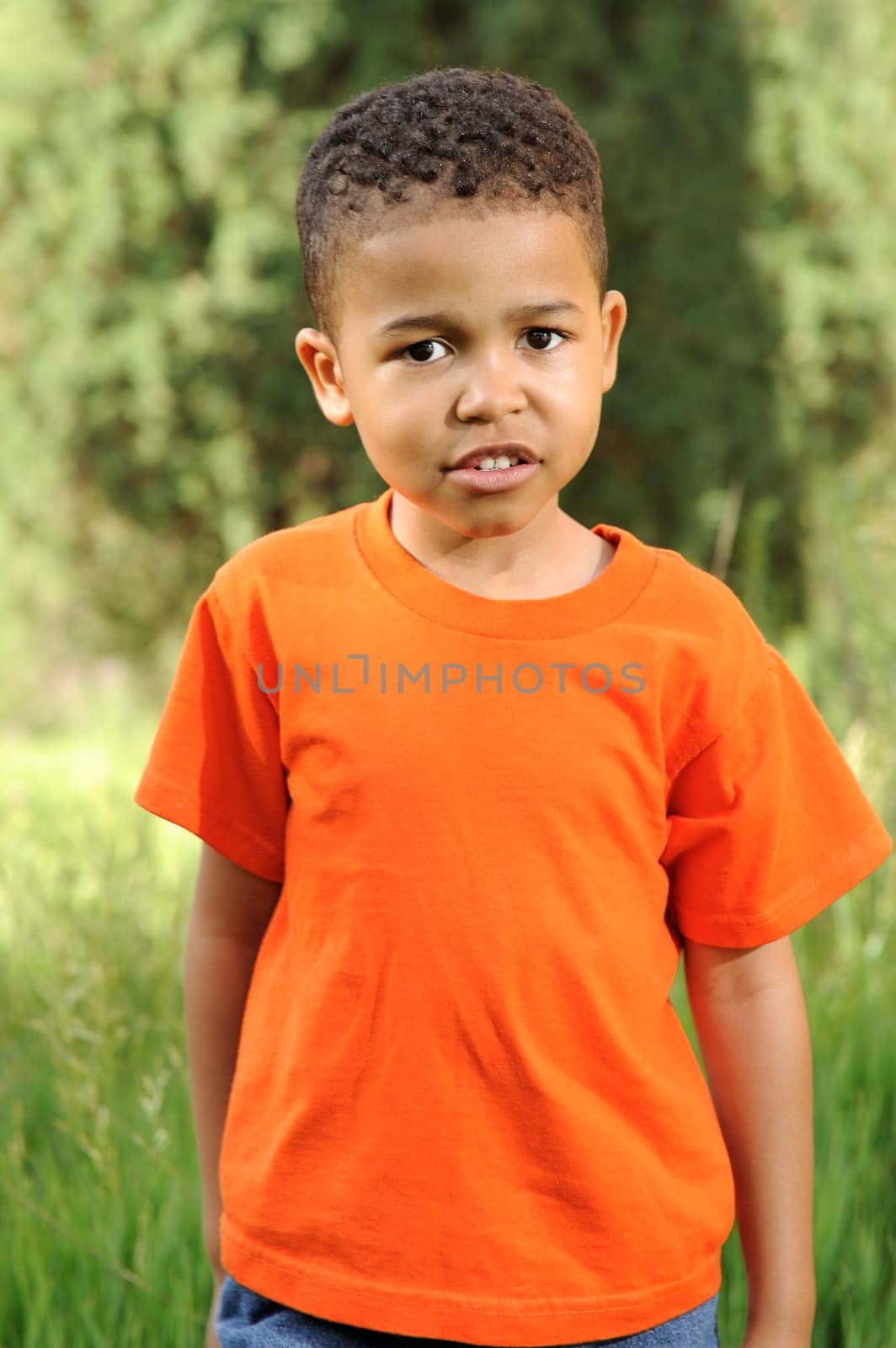 African American child playing in a meadow
