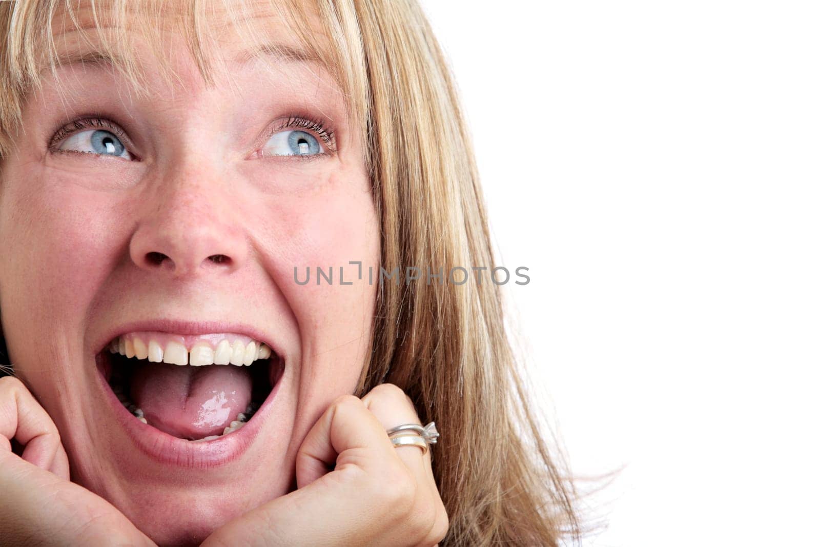 Surprised woman looking up with white background