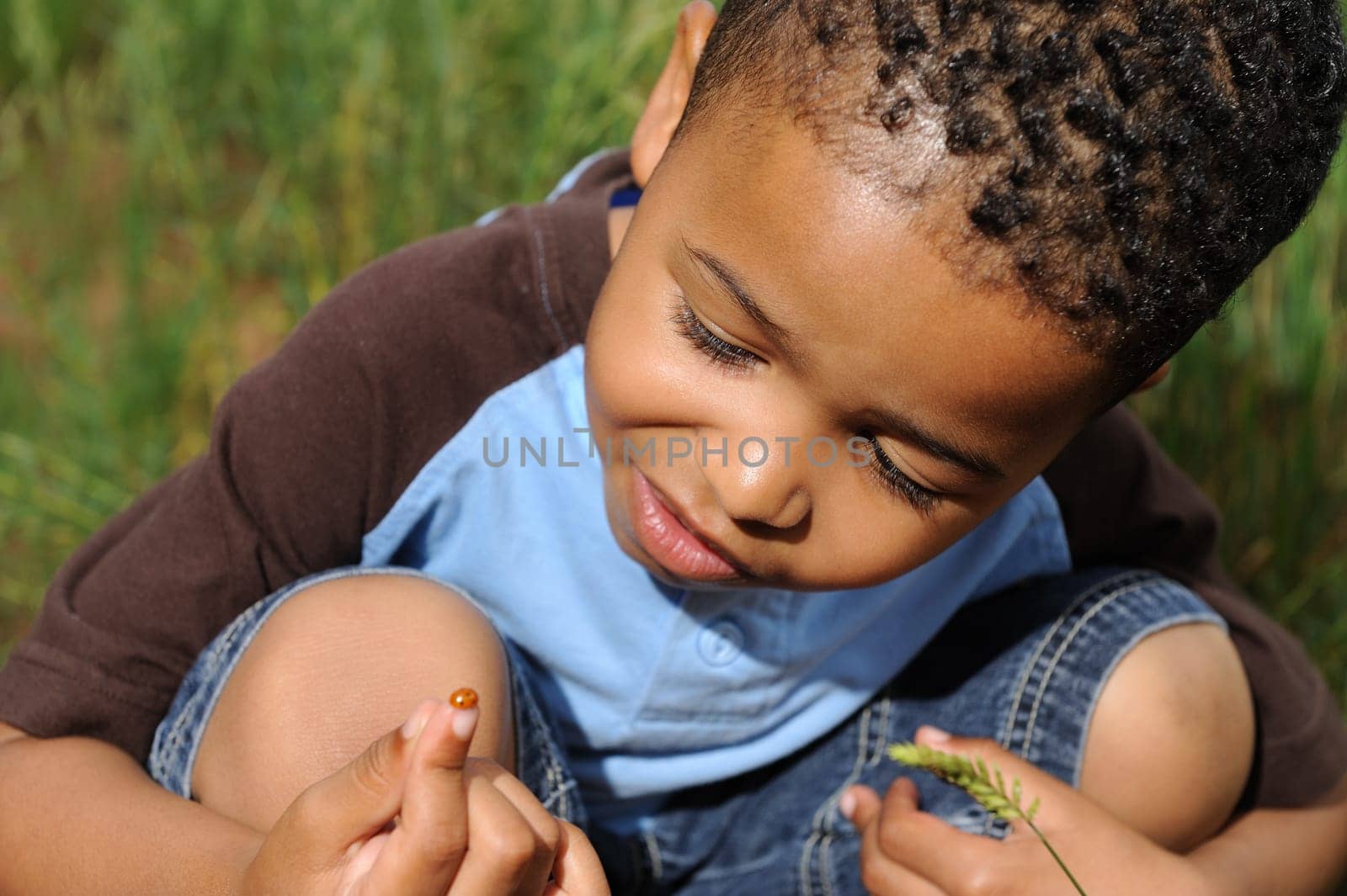 African American child playing in a meadow