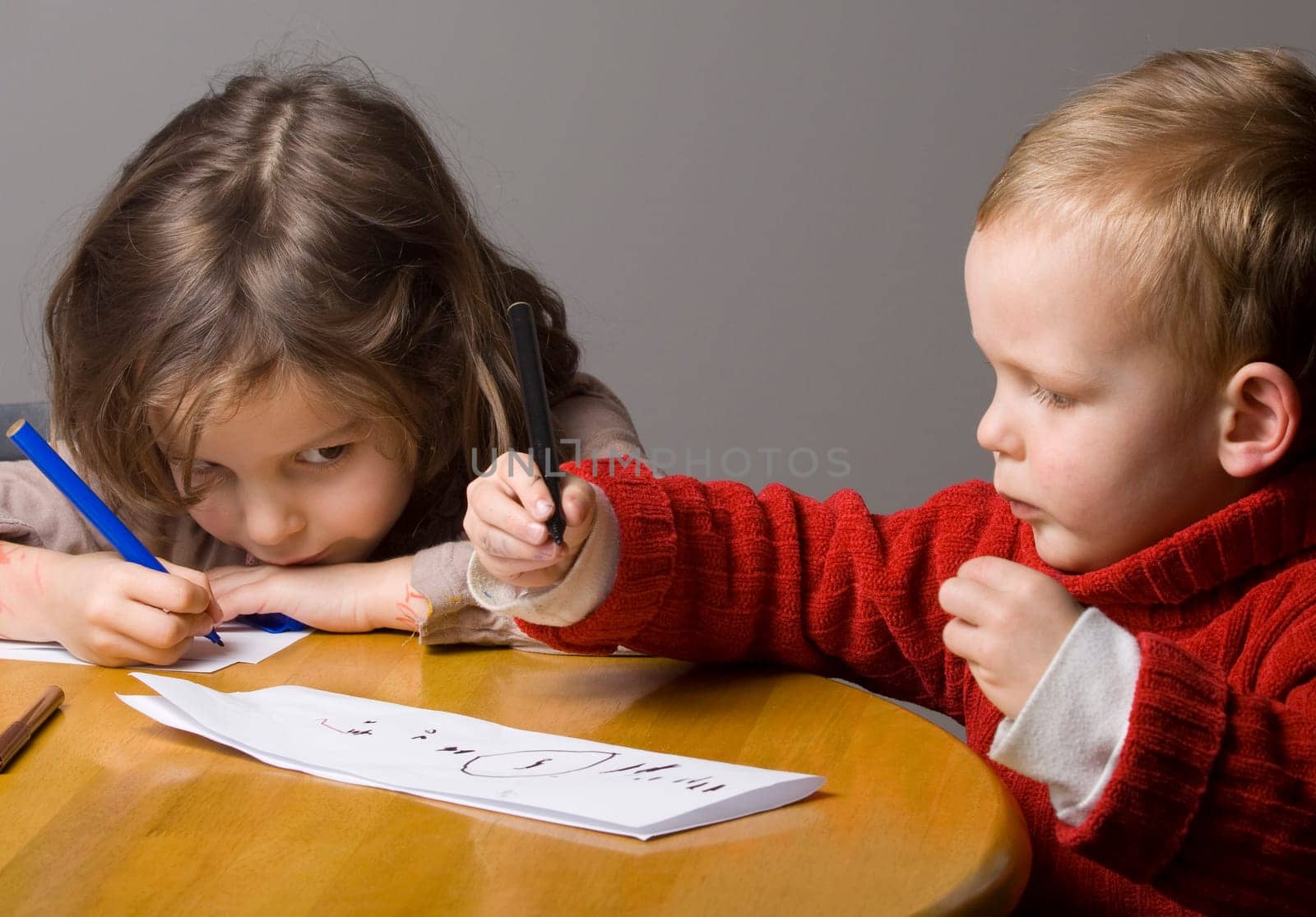 Little boy and girl drawing a picture