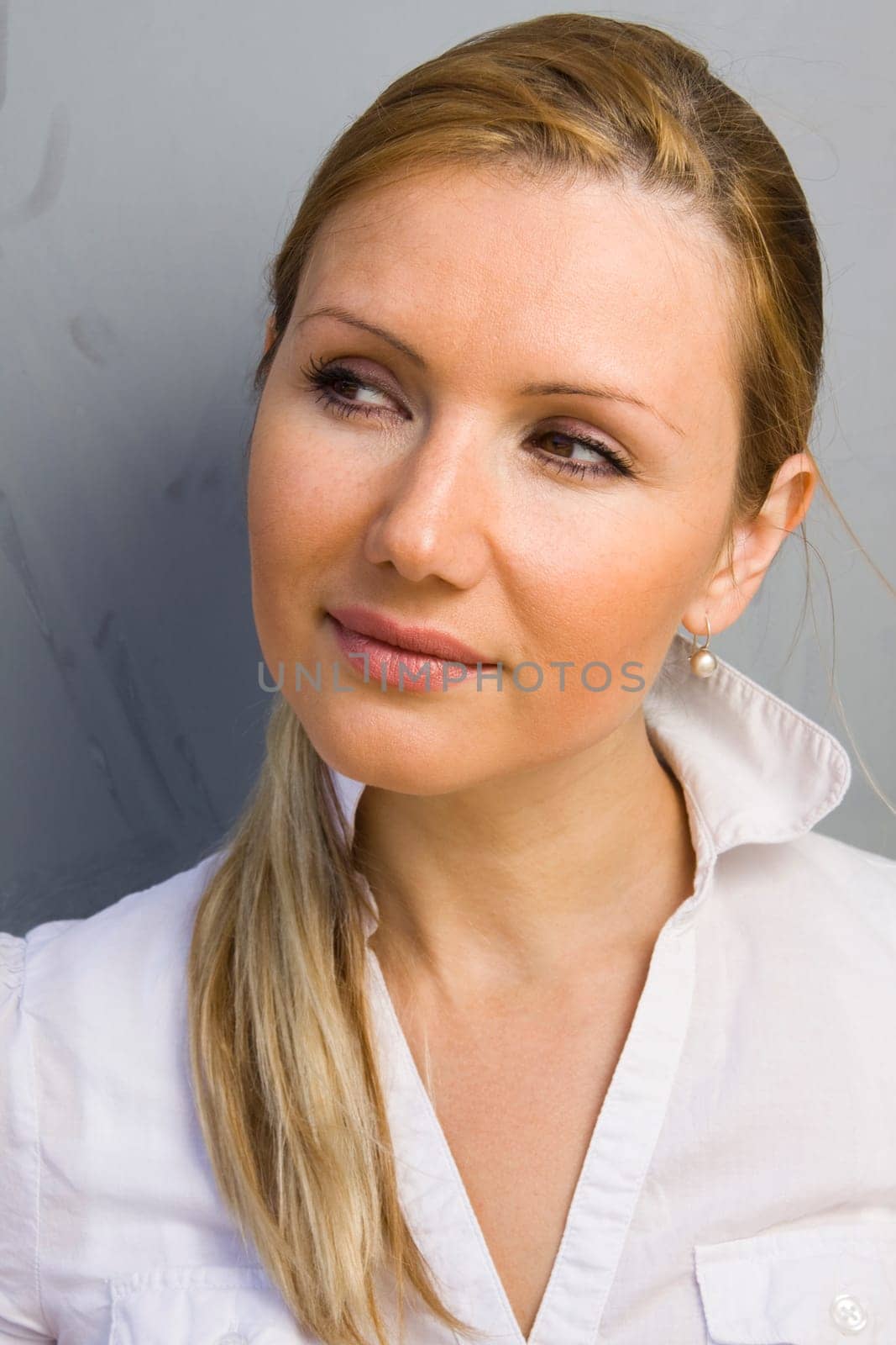 Portrait of young beautiful happy thinking woman
