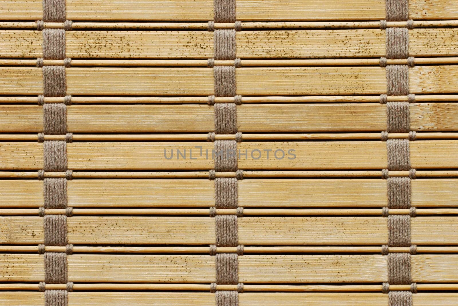 Brown woven wooden background tied with cords