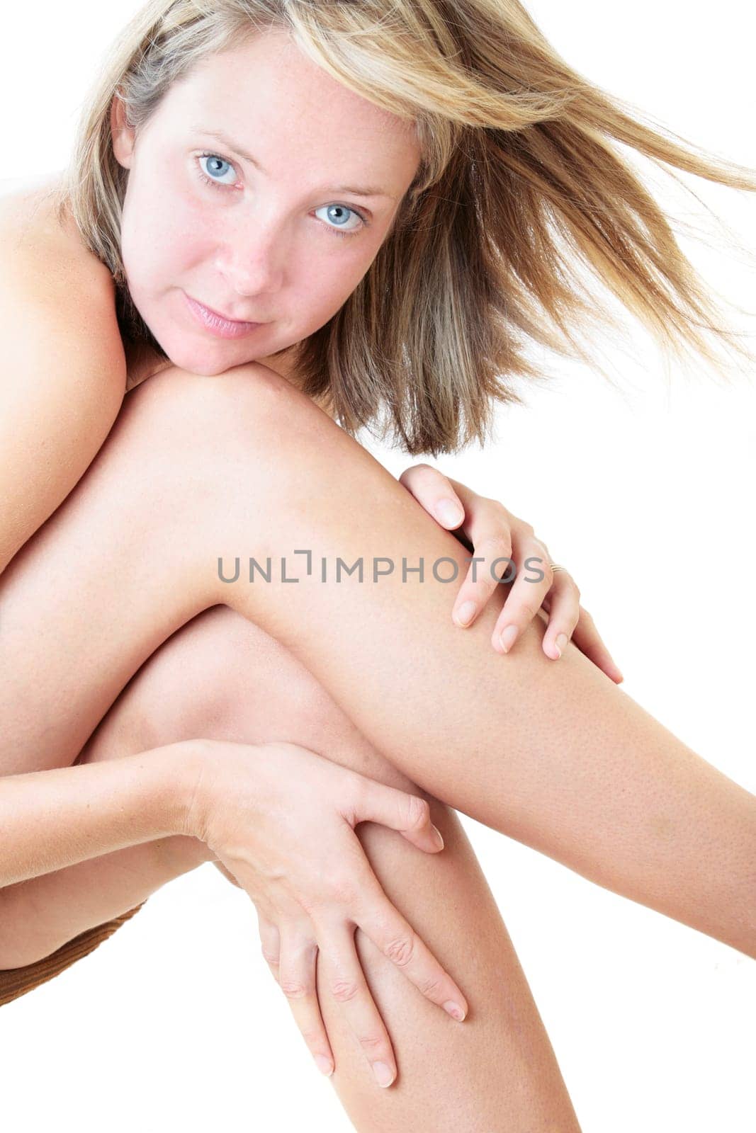 Nude woman sitting