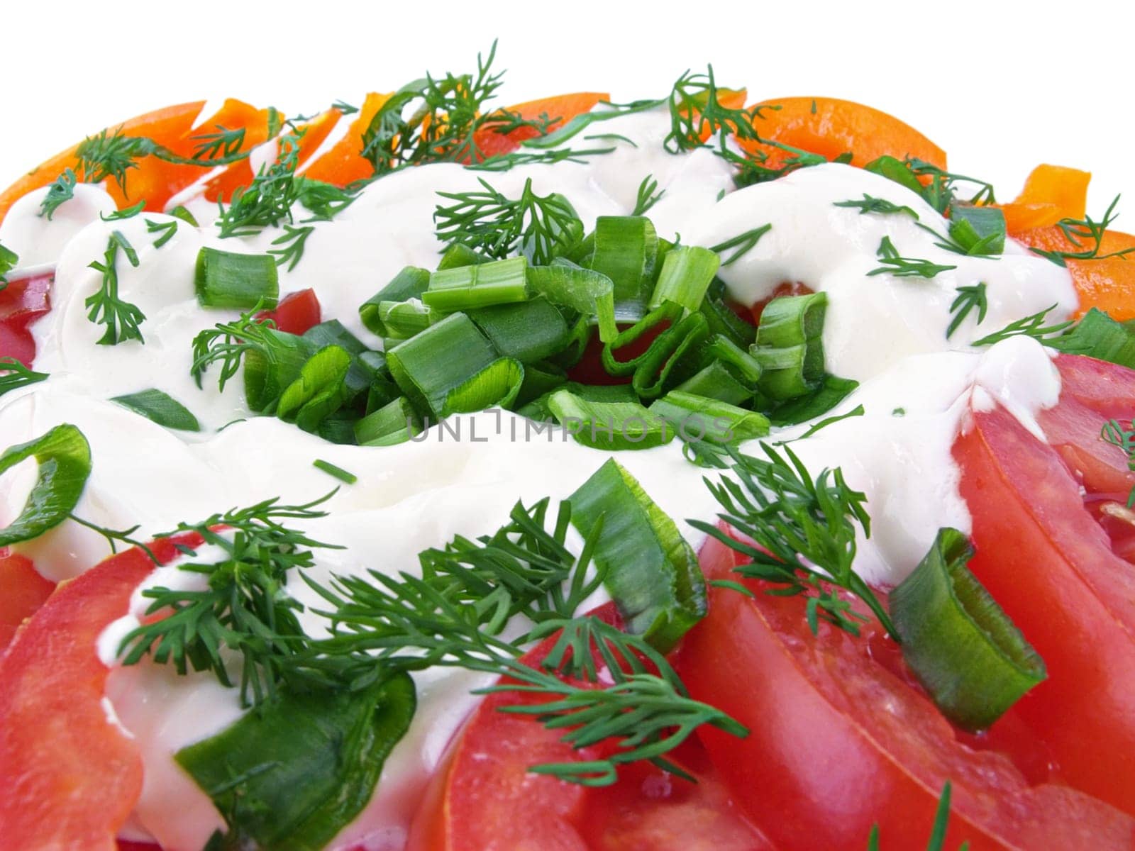 Vegetable salad of tomatoes, sweet peppers, spring onions, dill and sour cream