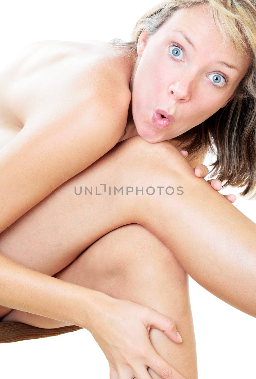 Nude woman sitting