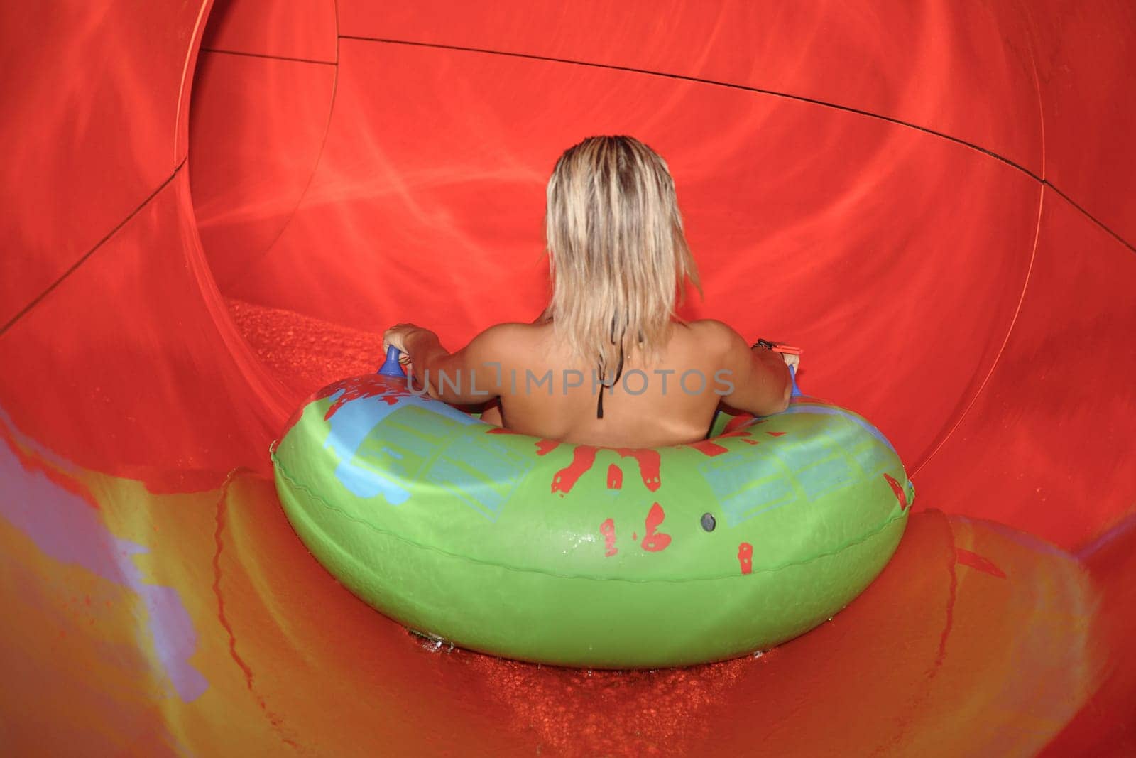 Driving from waterslides in an aquapark. Entertainment for children and adults.