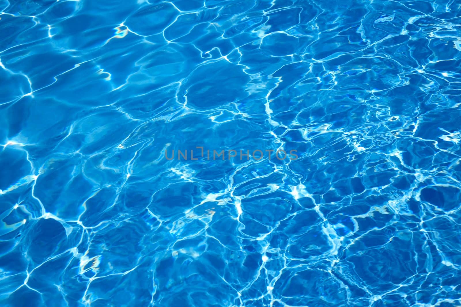 Bright blue swimming pool water as a background