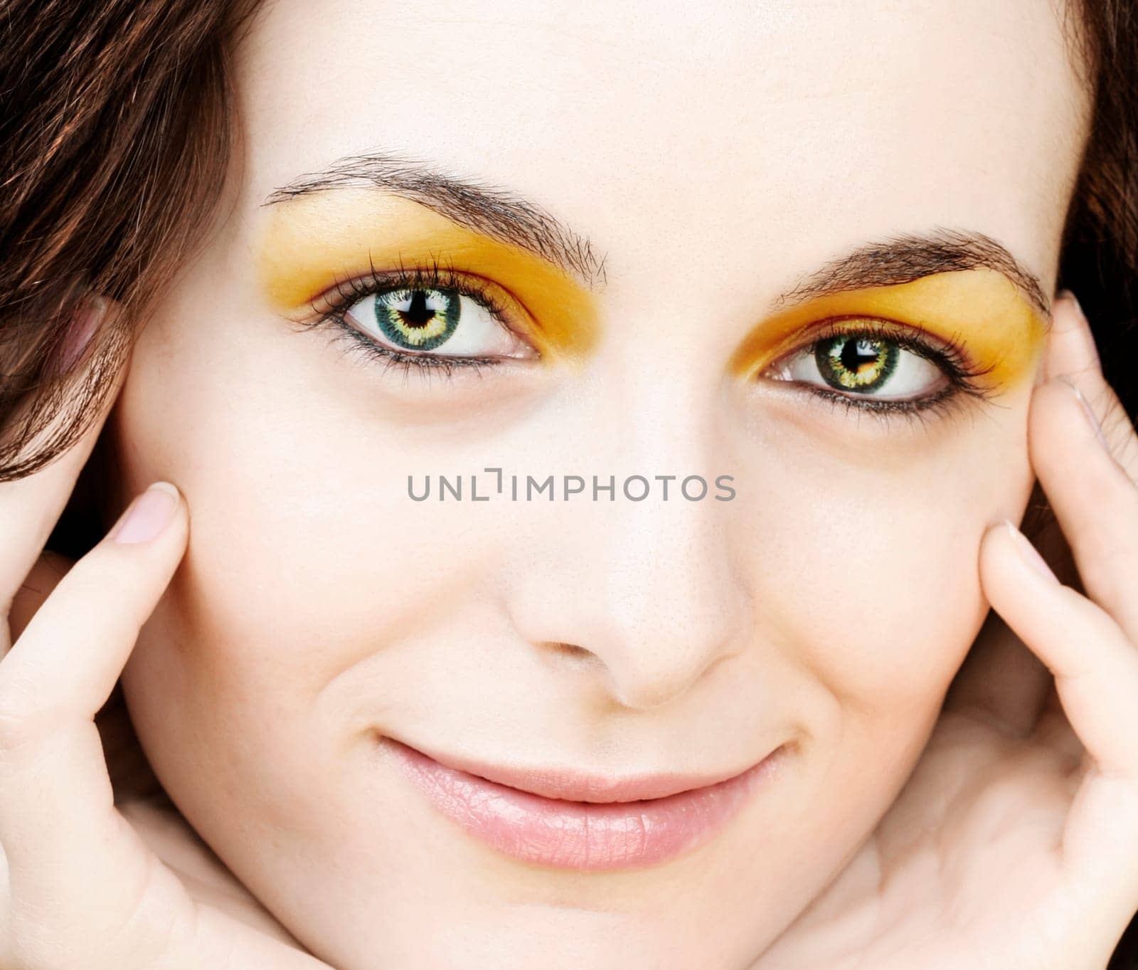 Beautiful happy woman with green eyes.