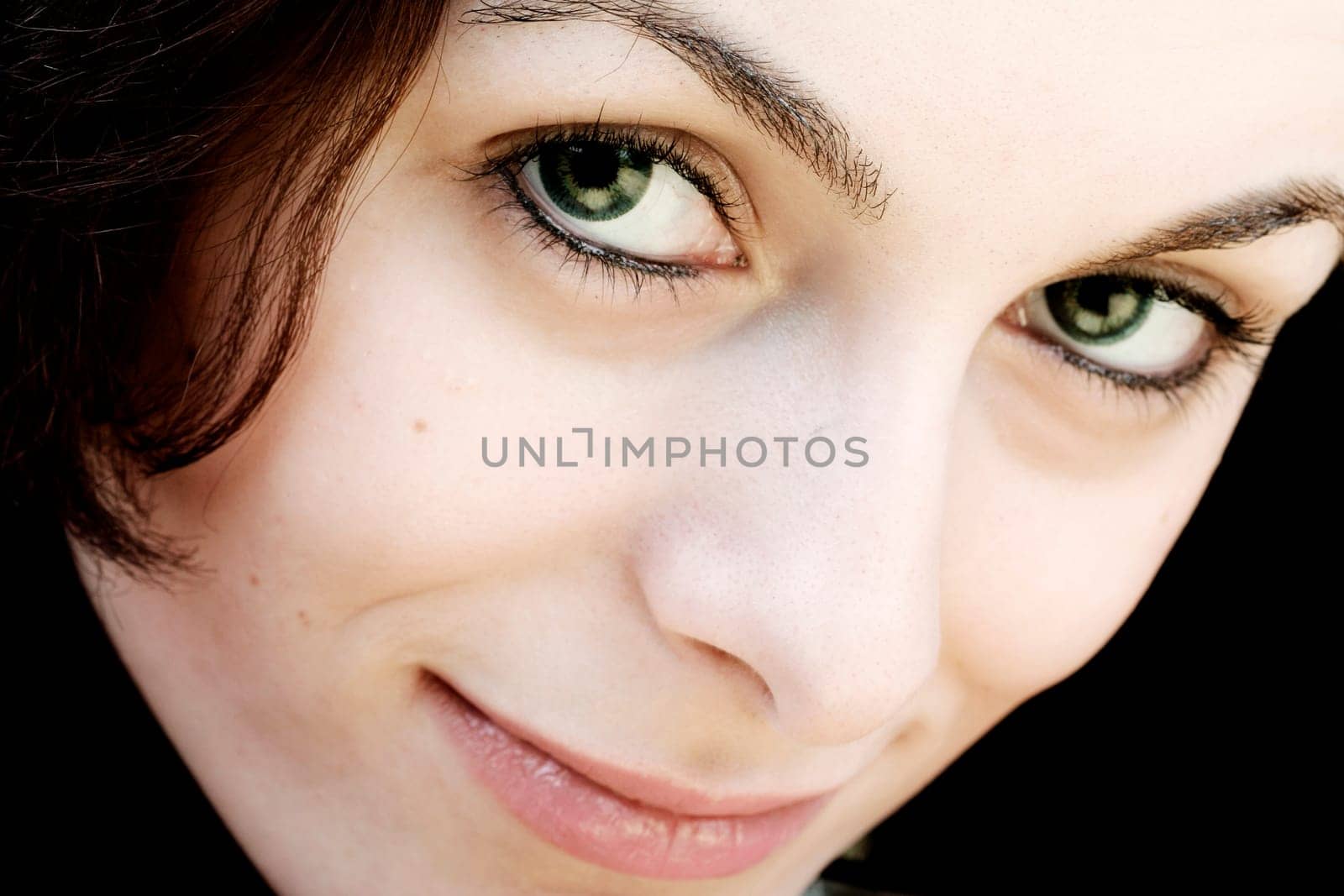 Beautiful happy woman with green eyes.