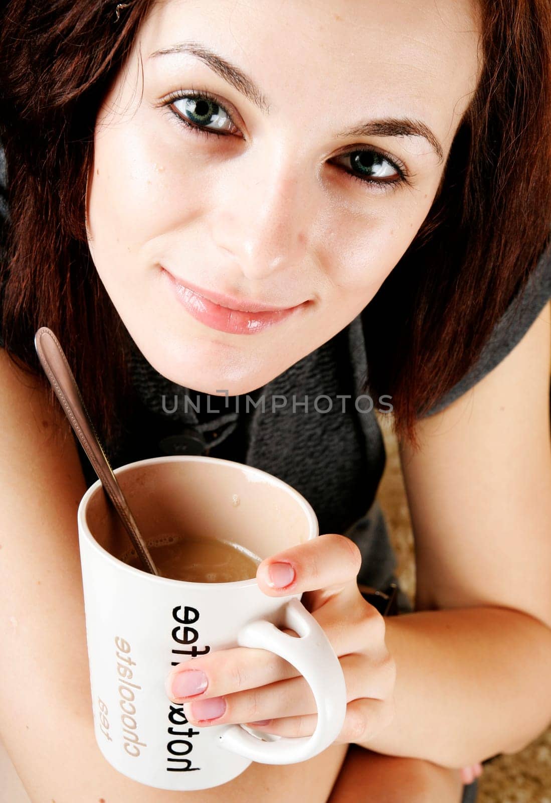 Beautiful woman drinking a cup of coffee