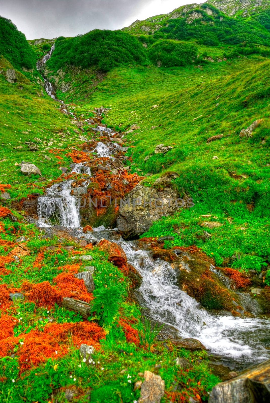 beautiful long watterfall. cascade in the morning sun light,  HDR.