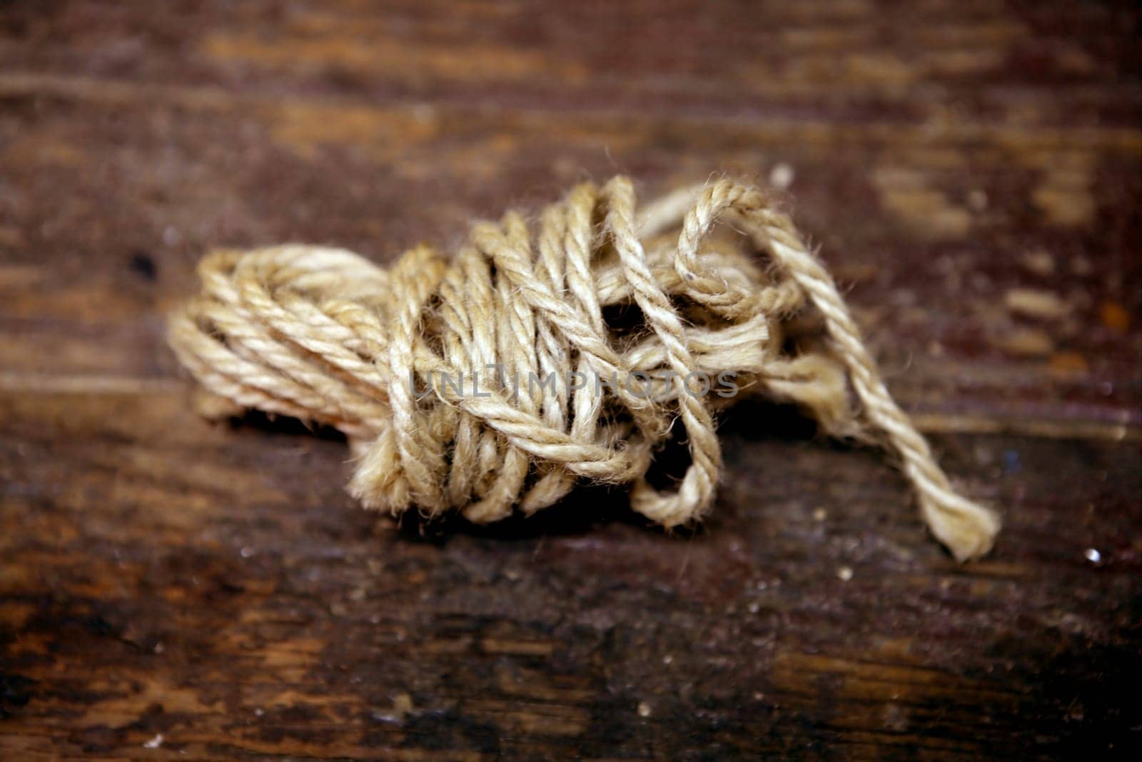 Thread old spool over an aged brown wooden surface