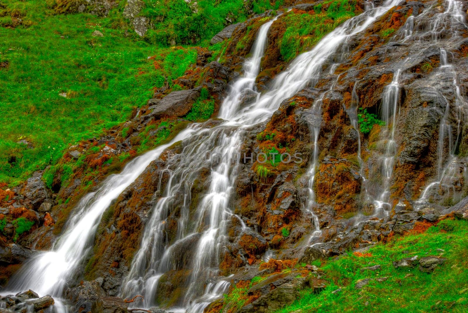 beautiful cascade in the morning light,  HDR. Long exposure time gives an "out of time"" feeling."