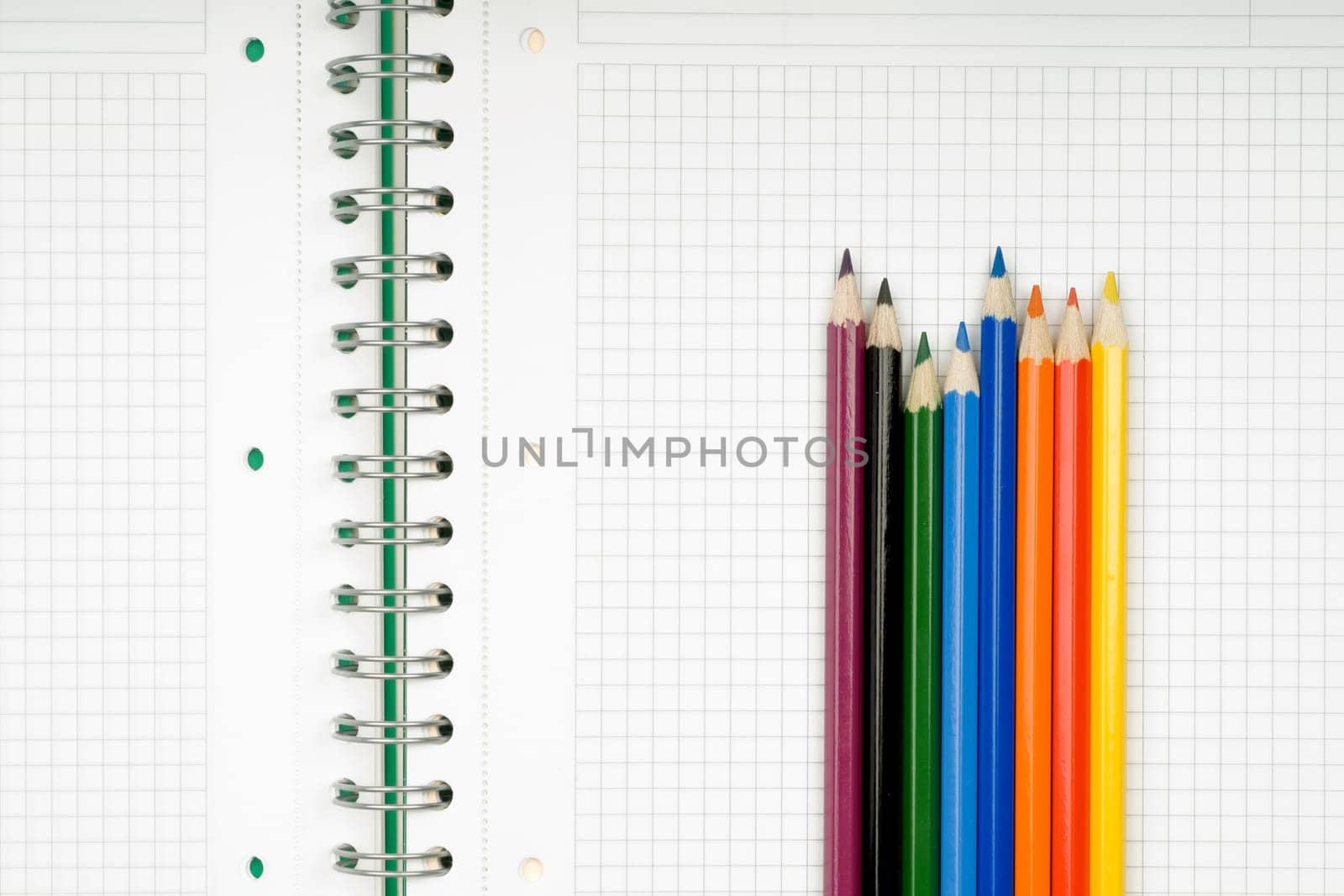 close up of notebook and pencil on white background with clipping path