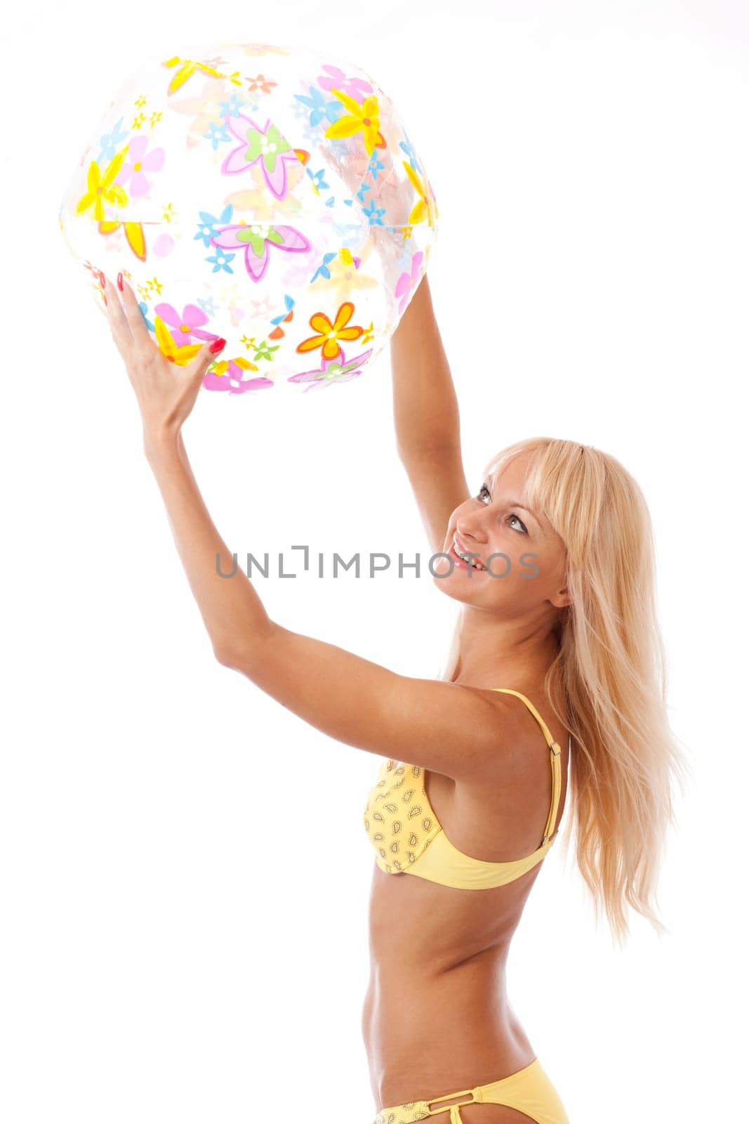 pretty long hair blond woman in yellow bikini with ball